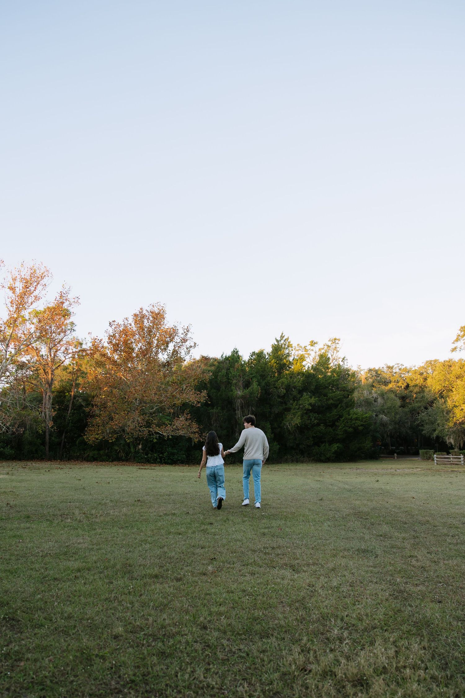 Cute college couple at Philippe Park is captured holding hands for their anniversary couples photos taken Michaela Gom Photography.
