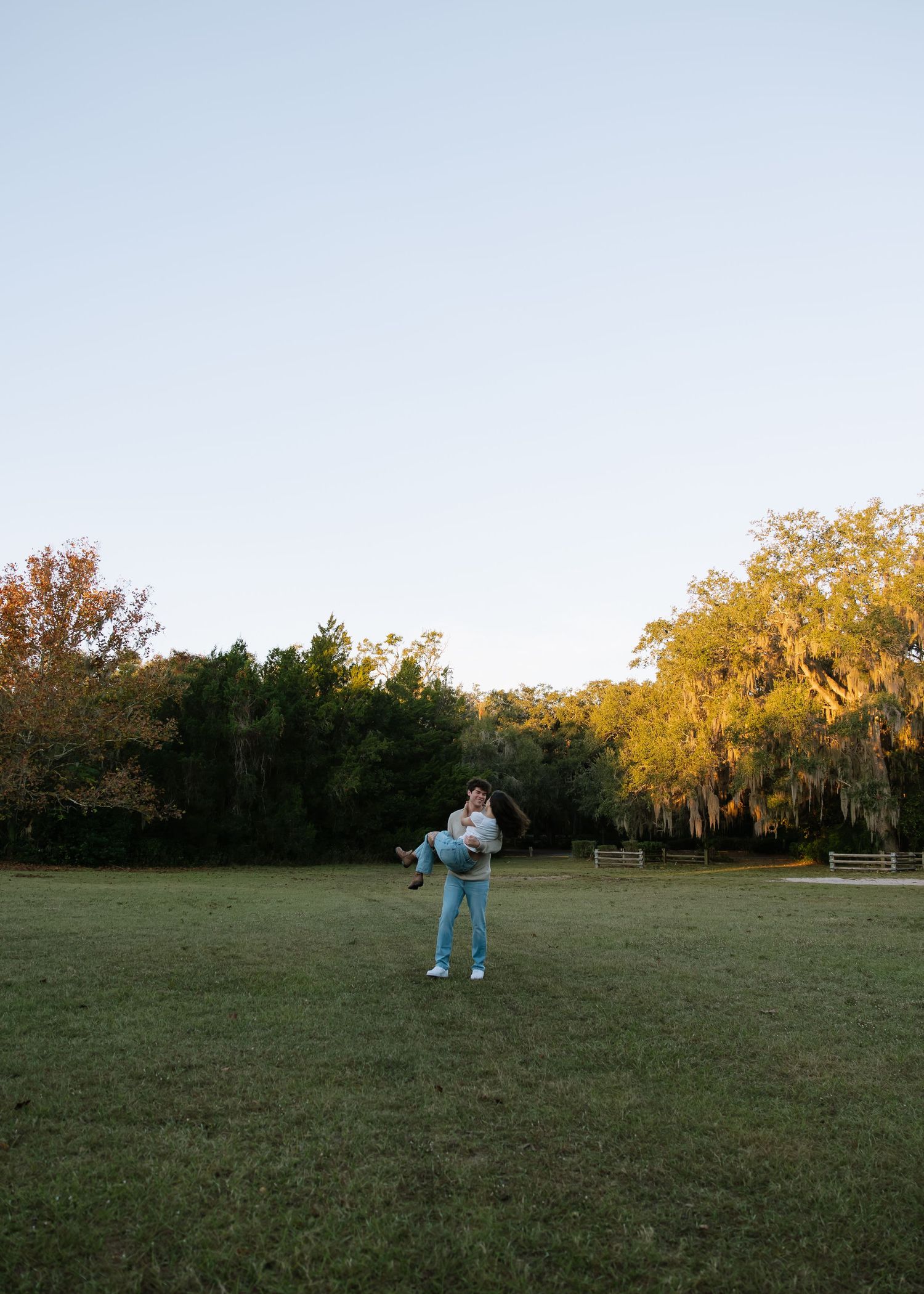 Boyfriend is holding his girl at Philippe Park in their anniversary photos taken by couples photographer Michaela Gom Photography.