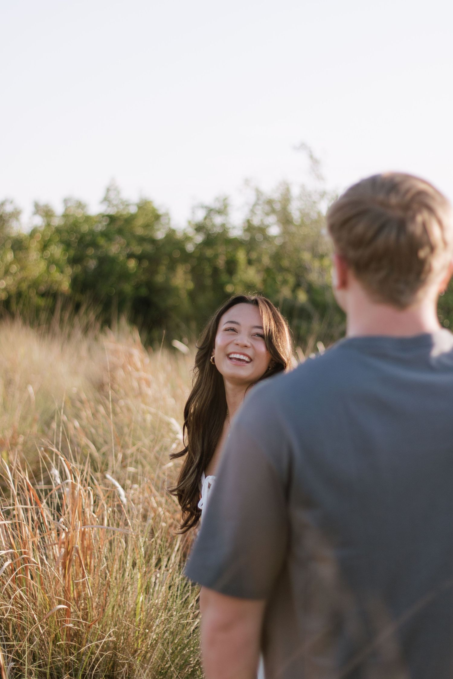 Young love at Cypress Point Park in Tampa celebrating their love captured by Michaela Gom Photography.