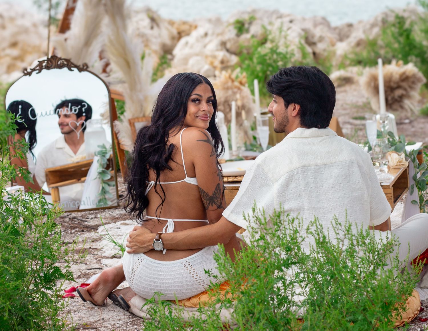 A romantic couple's photoshoot among wildflowers and natural scenery.