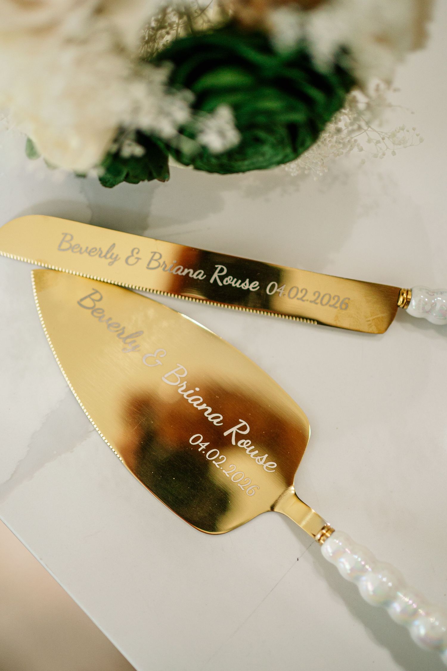 Gold engraved wedding cake server set with pearl handles inscribed Beverly & Briana Rouse 04.02.2026.