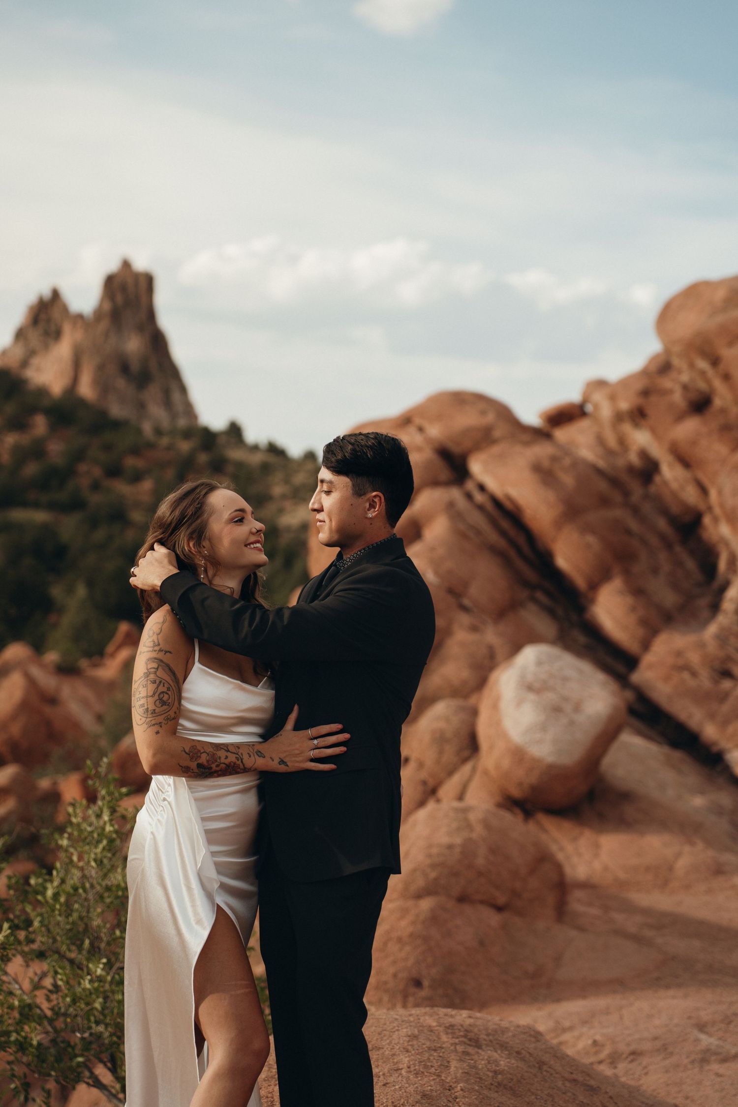 A romantic photo shoot at Garden of the Gods with red rock formations creating a stunning natural backdrop.
