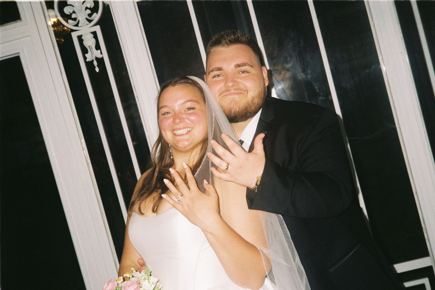 Series of black and white photo booth style wedding portraits against a striped background.