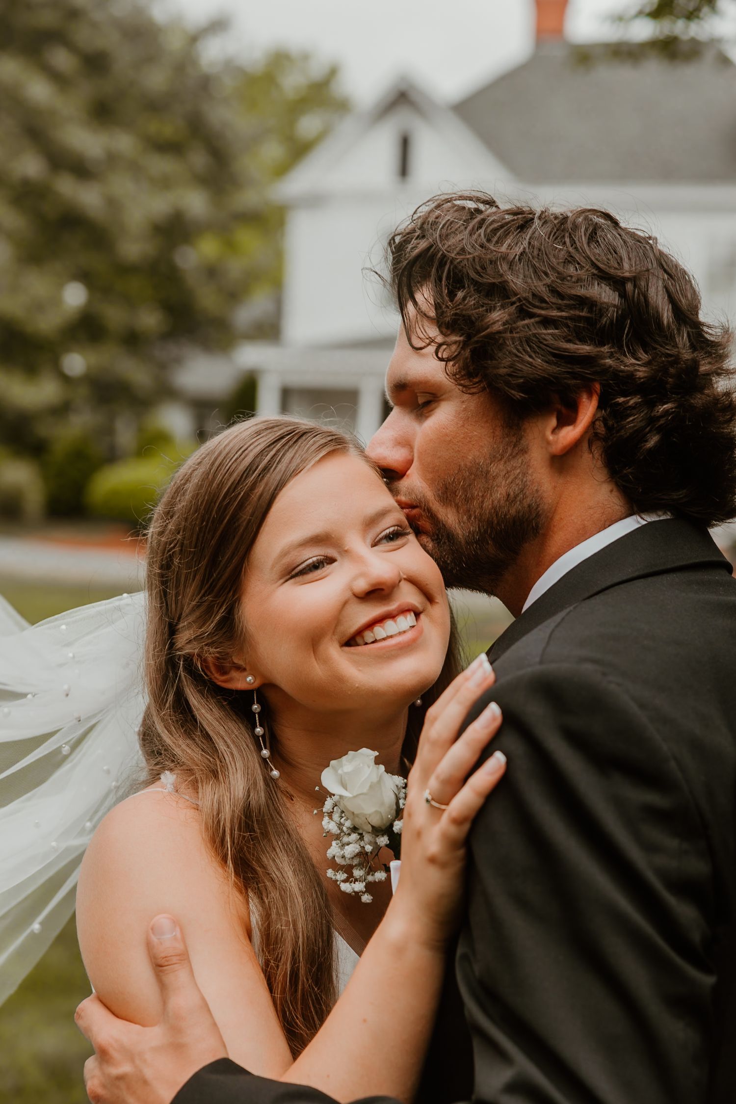 Intimate wedding moment captured during an outdoor celebration.