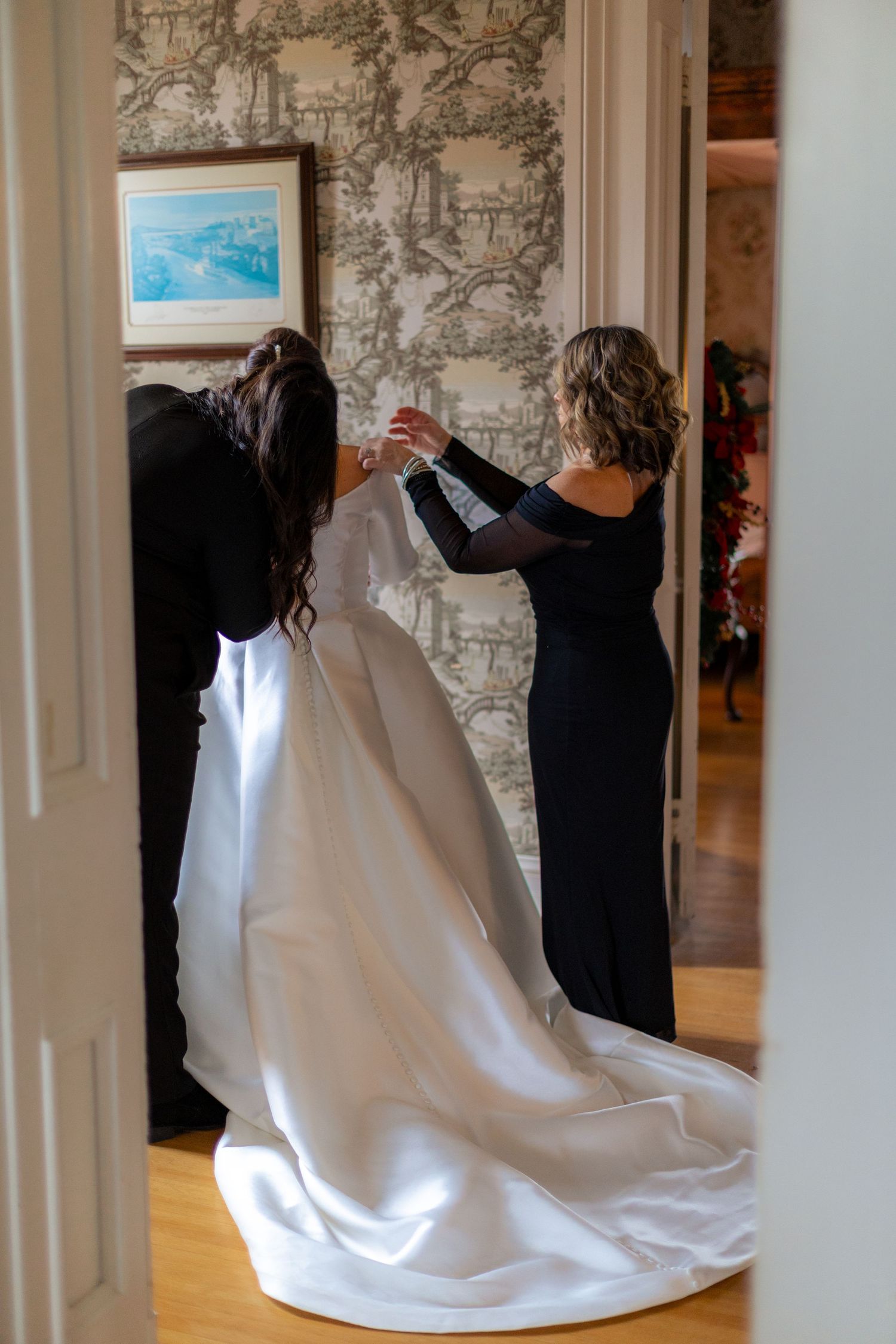 A series of photos showing people adjusting a white wedding dress train in an elegant indoor setting.
