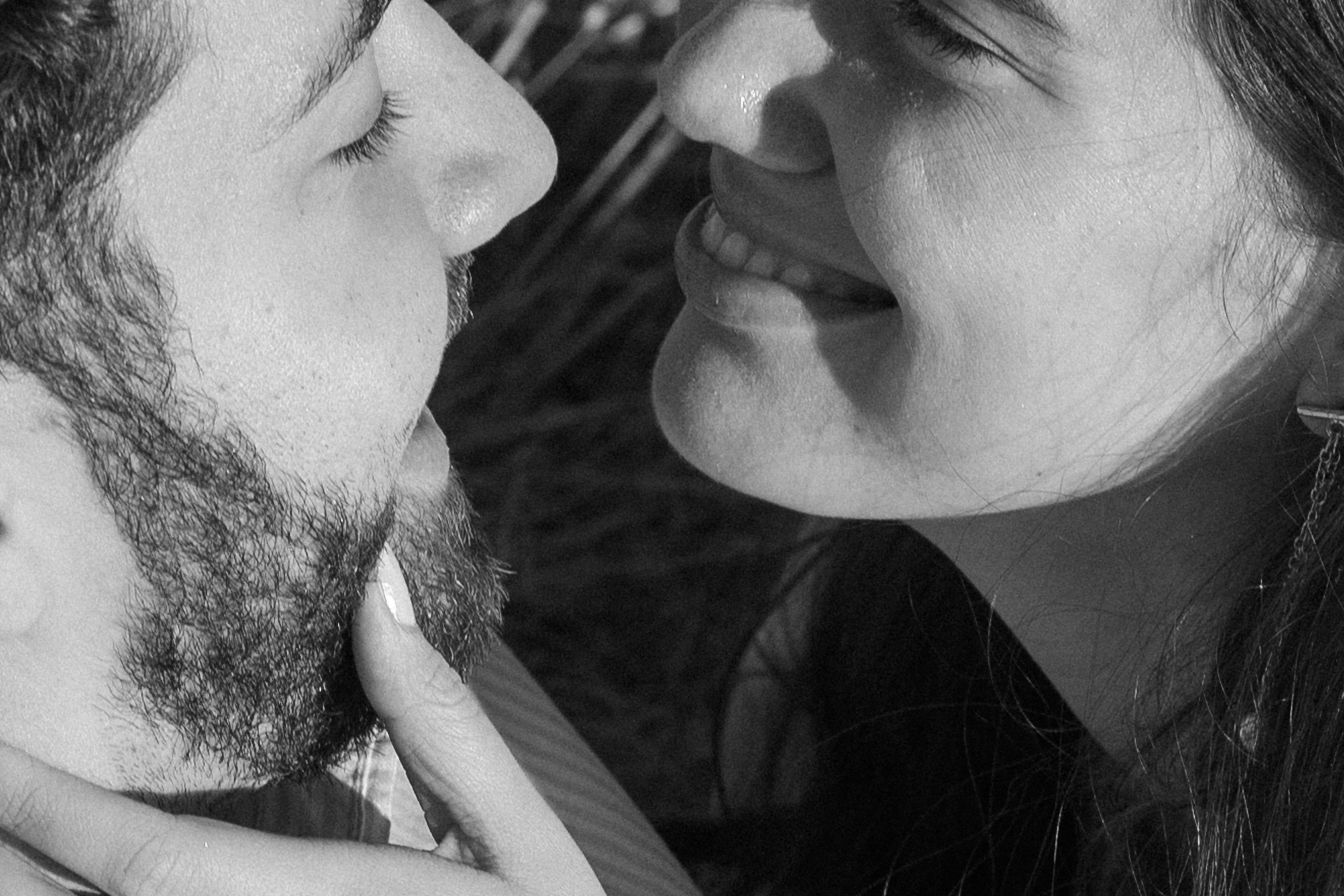 A romantic black and white photo series showing close-up shots of couples about to kiss.