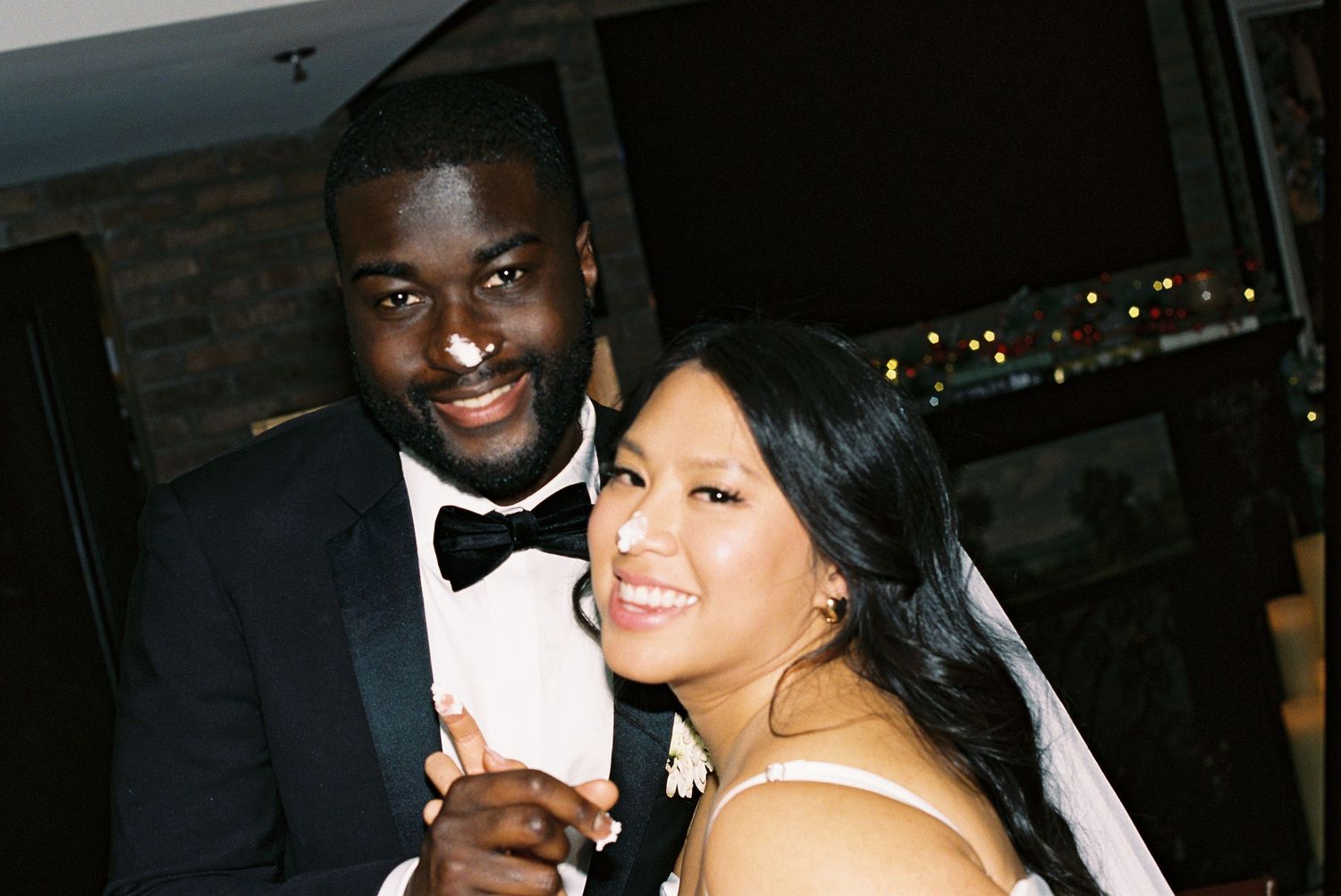 Wedding celebration captured in candid moments during an evening reception.