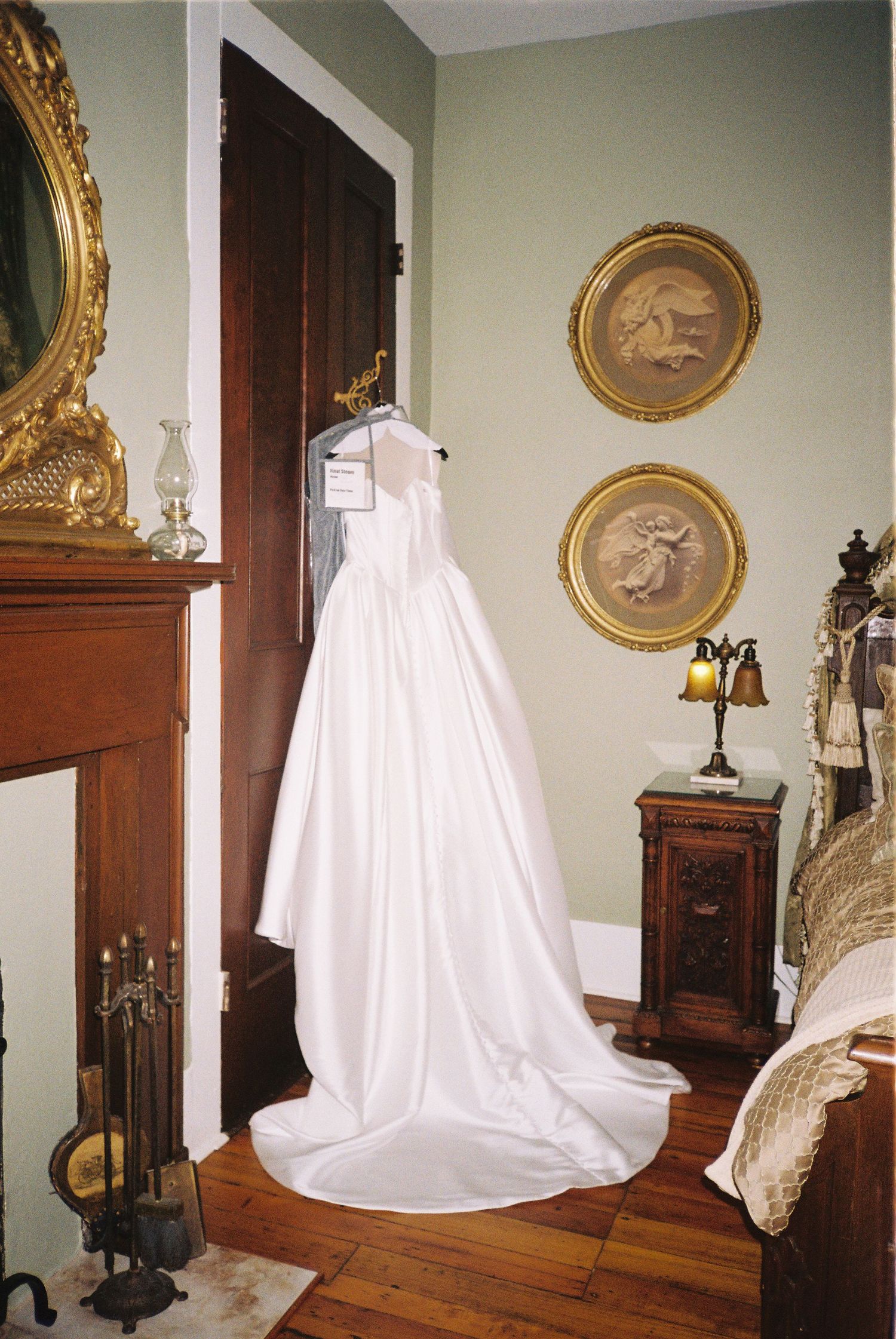A series of photos showing a white ghost-like sheet installation in a vintage room with ornate gold frames and wooden furniture.