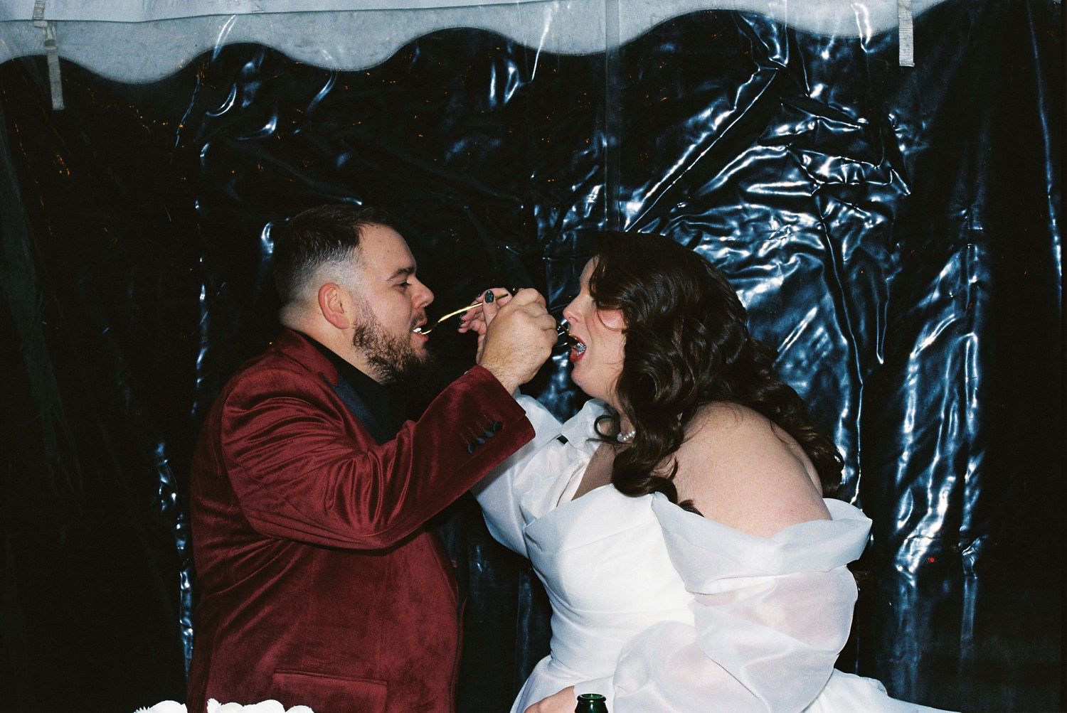 Candid moments of celebration and dancing at an evening wedding reception.