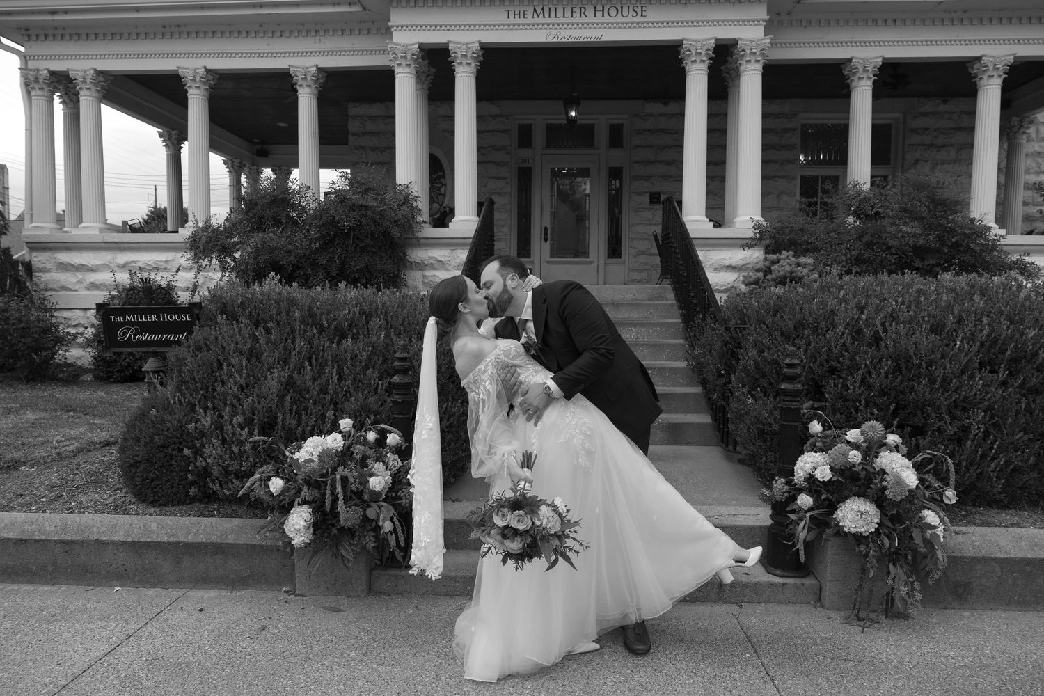A black and white collage of wedding photos showing couples and guests at a vintage-style outdoor venue.