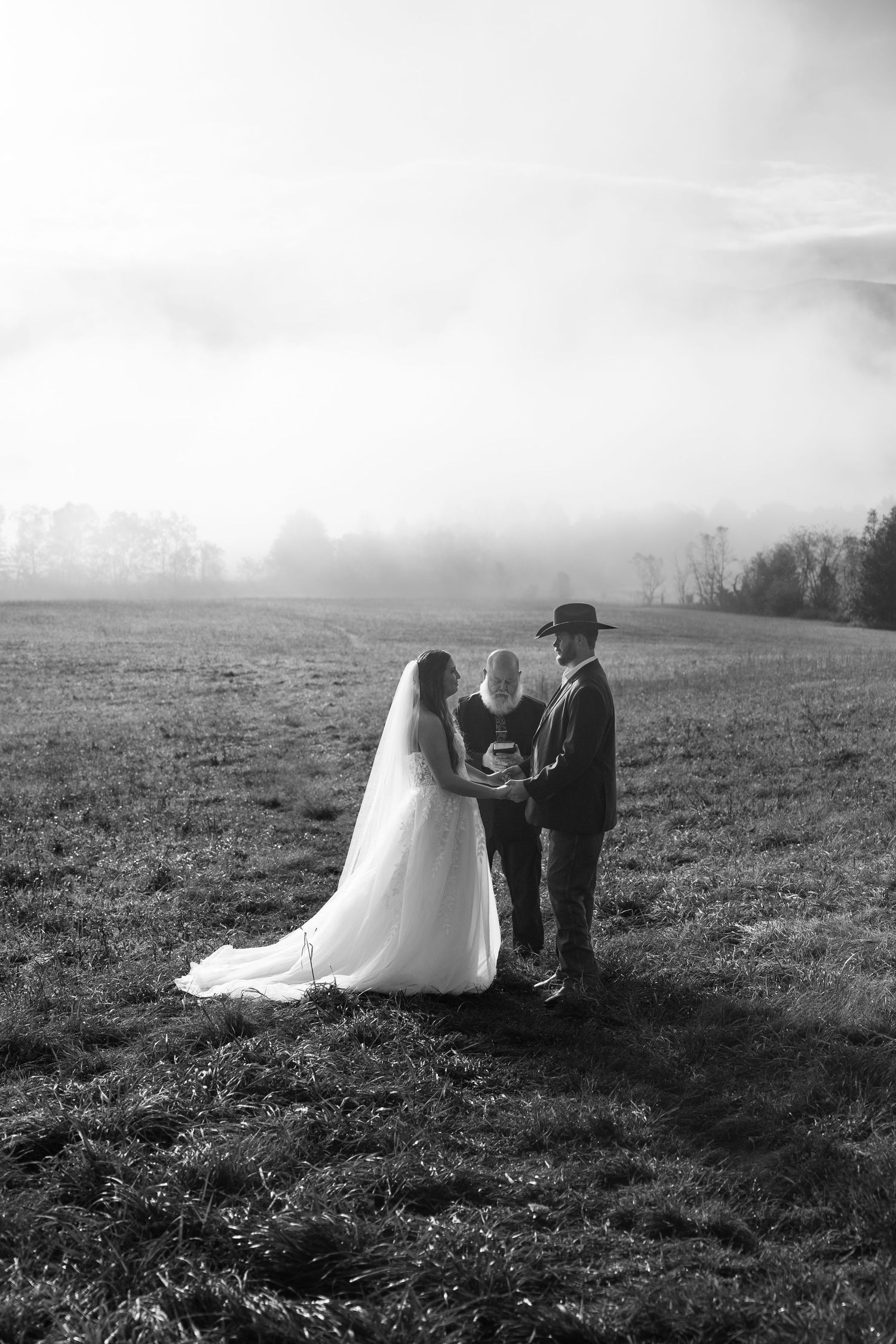 Black and white sequence of a wedding ceremony in a misty field.
