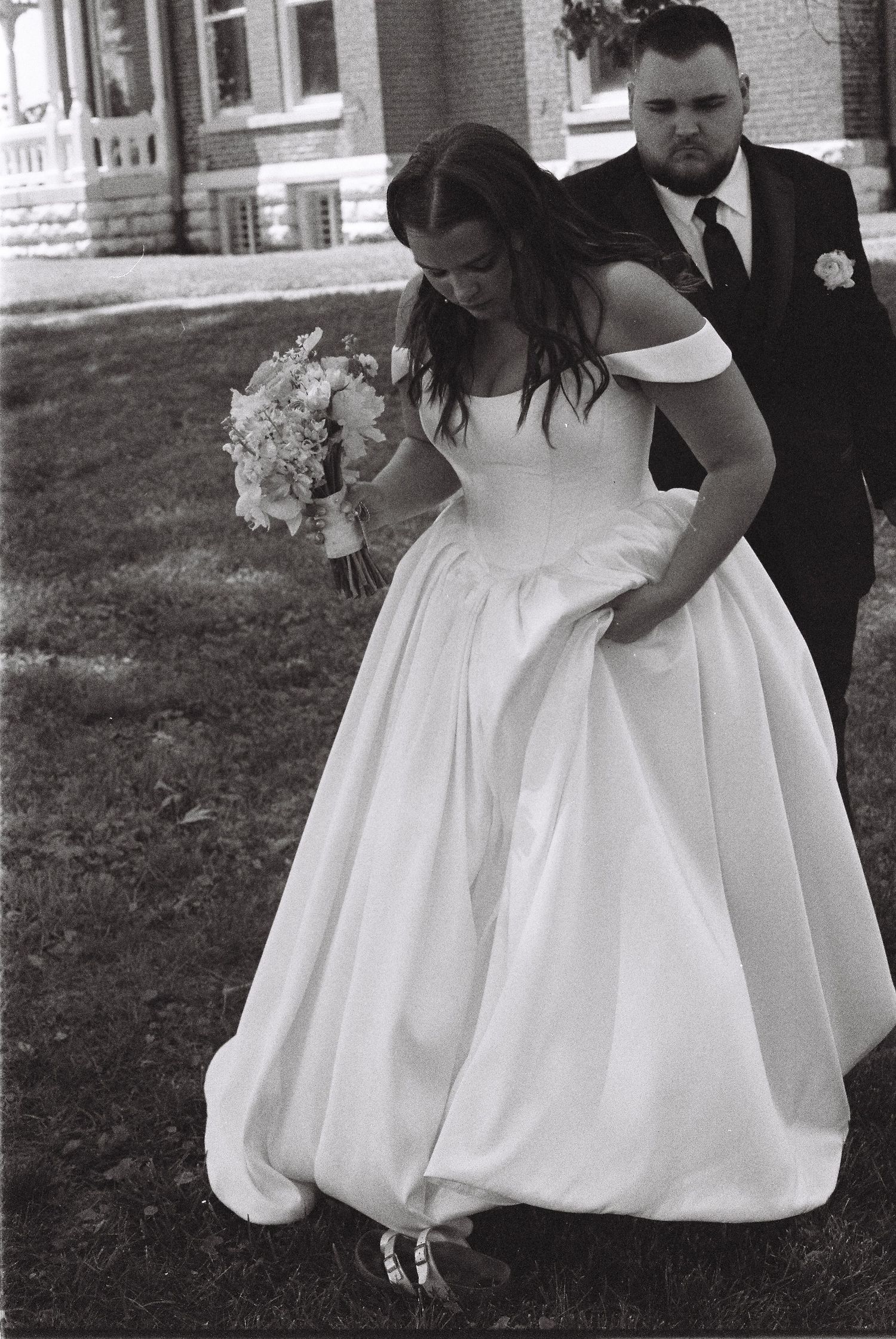 A series of black and white photos showing the bottom of a white wedding dress with gathered fabric details.