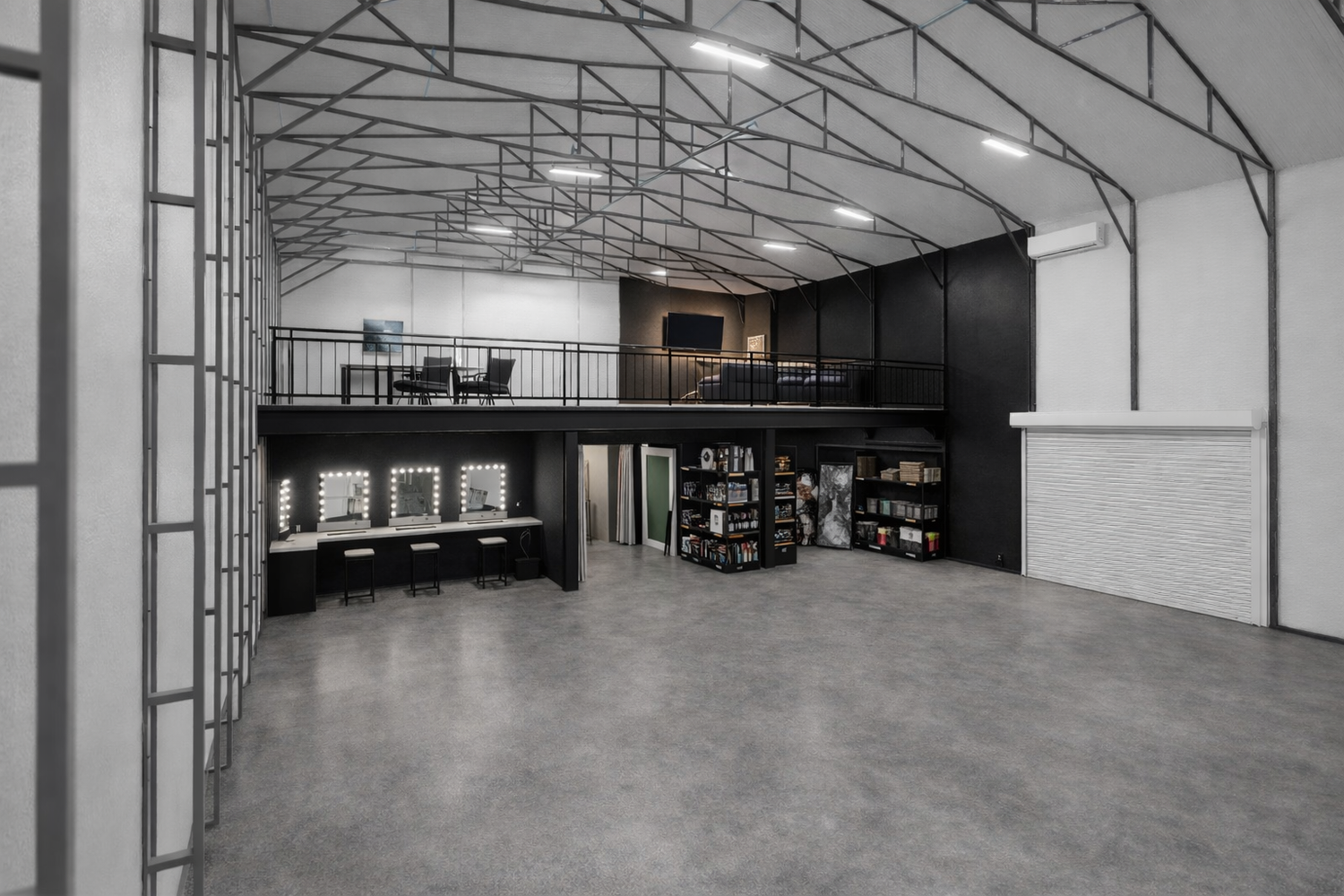 Empty commercial space with white walls and reflective flooring showing multiple connected warehouse sections.