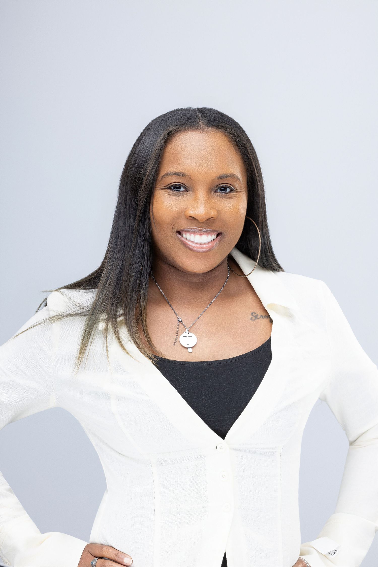 Professional portrait series featuring a person in a crisp white blazer against a light background.