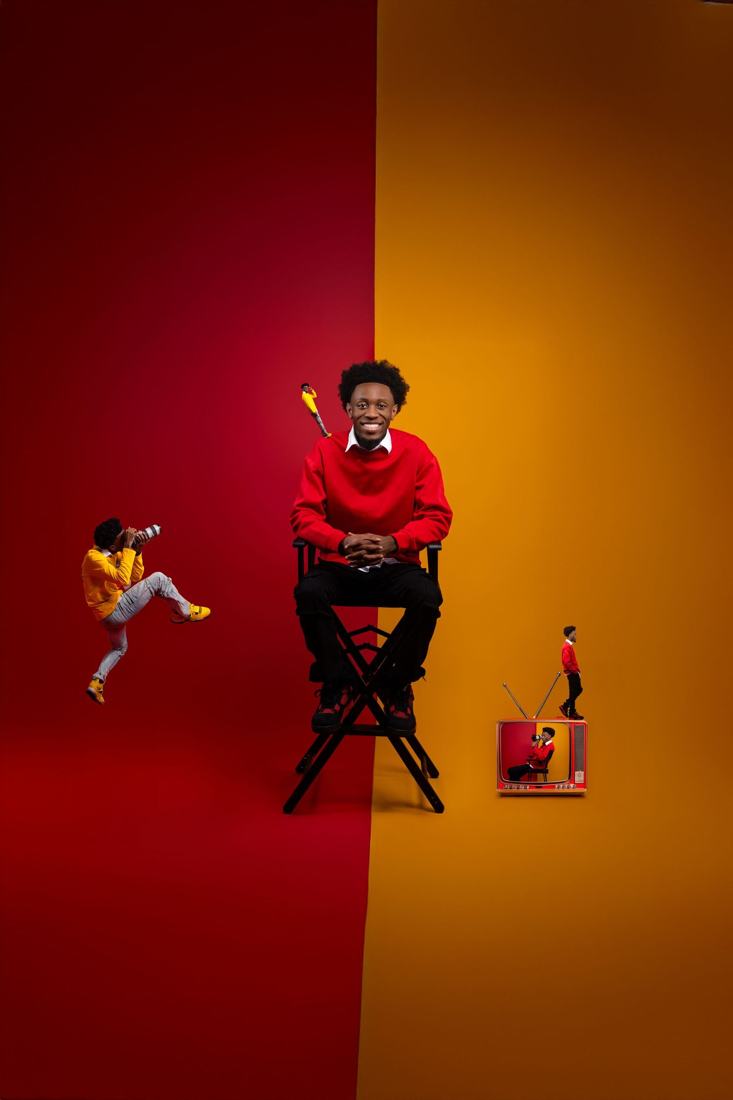 Creative portrait against red and yellow split background with sitting figure and miniature dancing figures in dynamic composition.