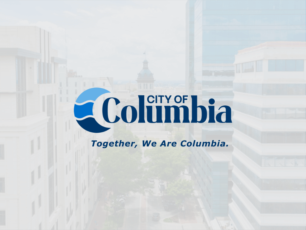 City of Columbia logo with blue wave design and slogan 'Together, We Are Columbia' on blurred cityscape background.