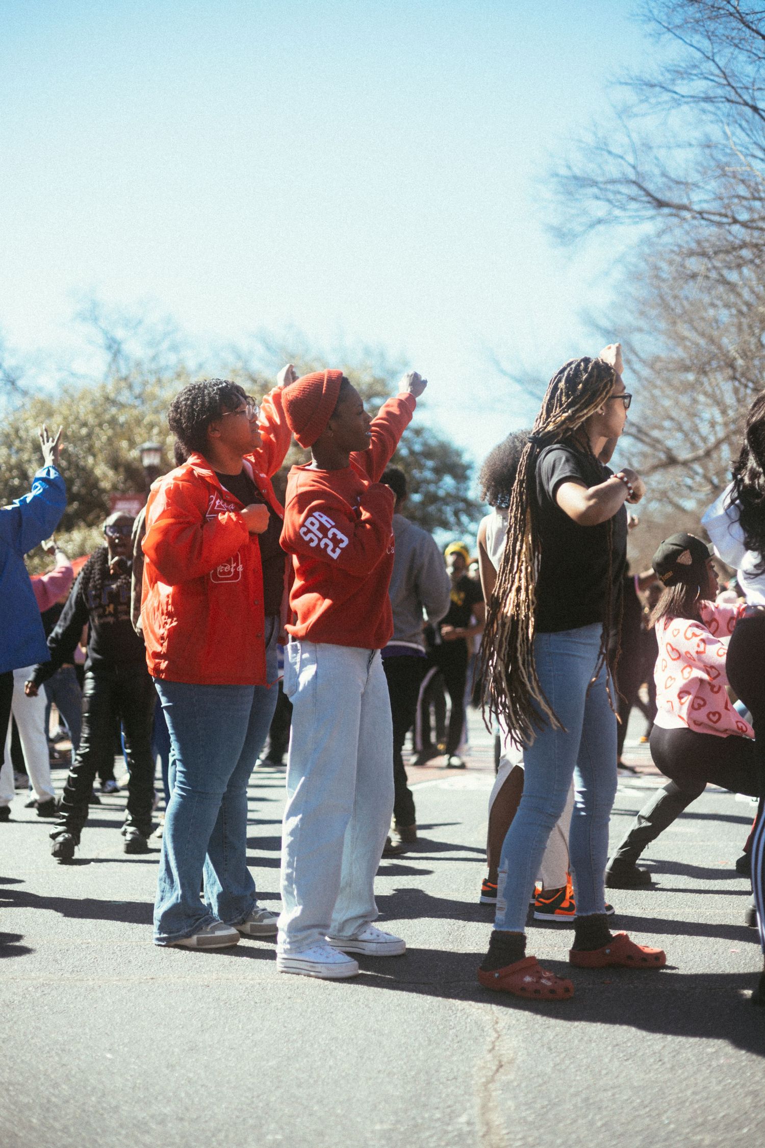 Delta's  dancing together outdoors on a sunny day wearing casual clothes and enjoying a group activity. USC Hip Hop Wednesday