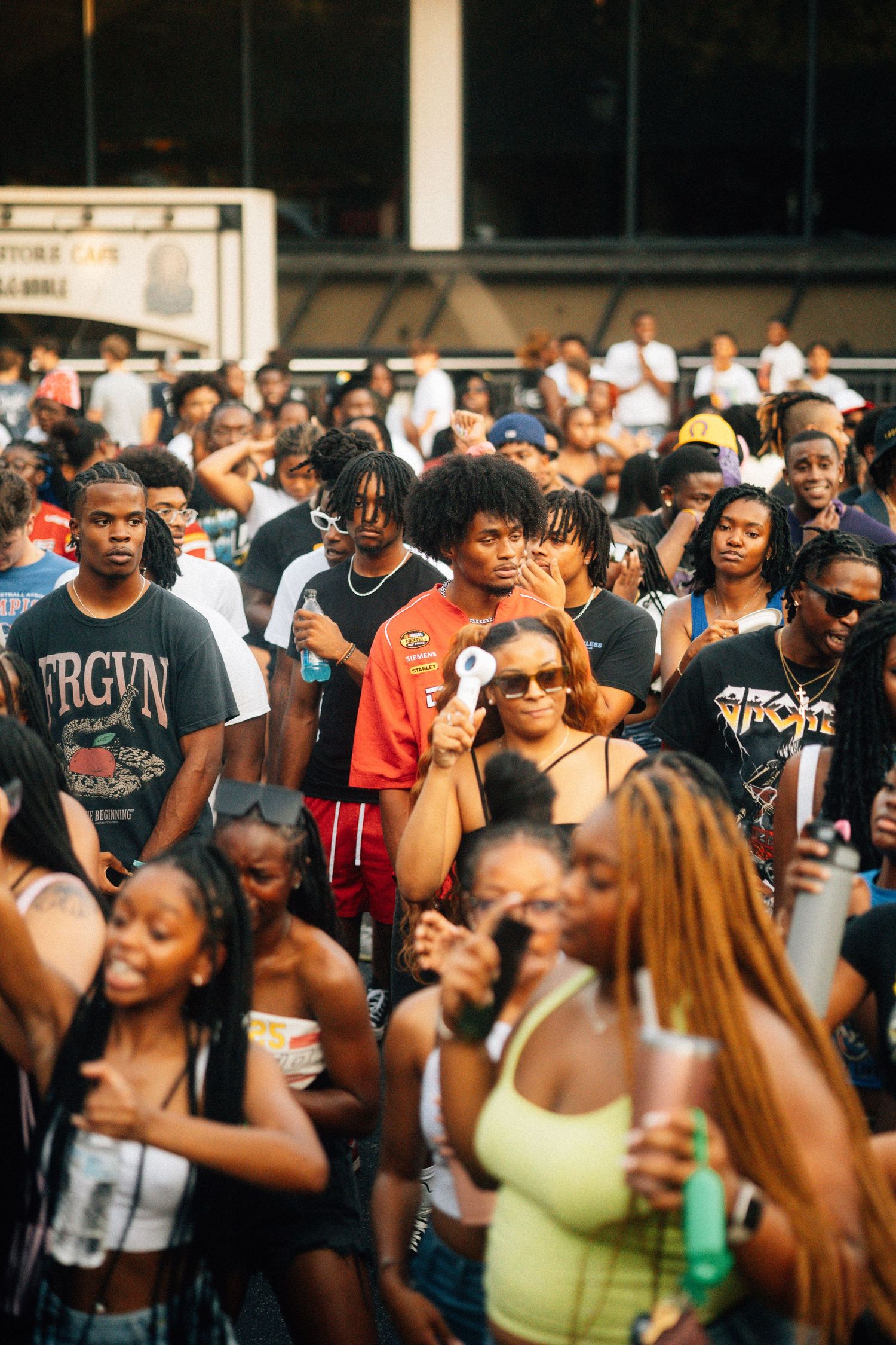 A large diverse crowd of people enjoying an outdoor summer event or festival in daylight. USC Hip Hop Wednesday