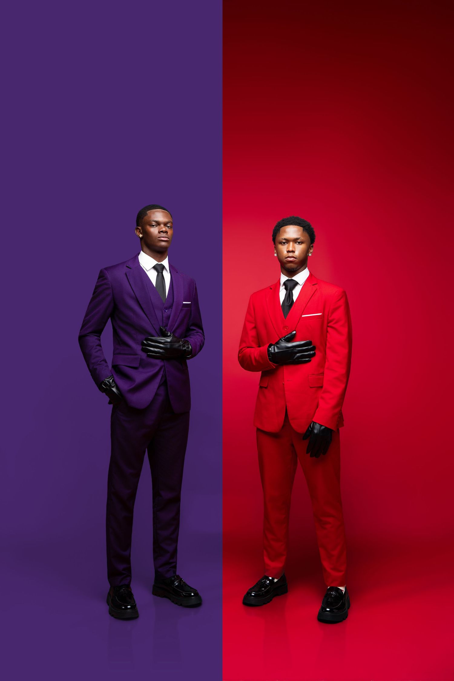 Two Black men in matching purple and red suits with black gloves pose against bold color-blocked backgrounds.