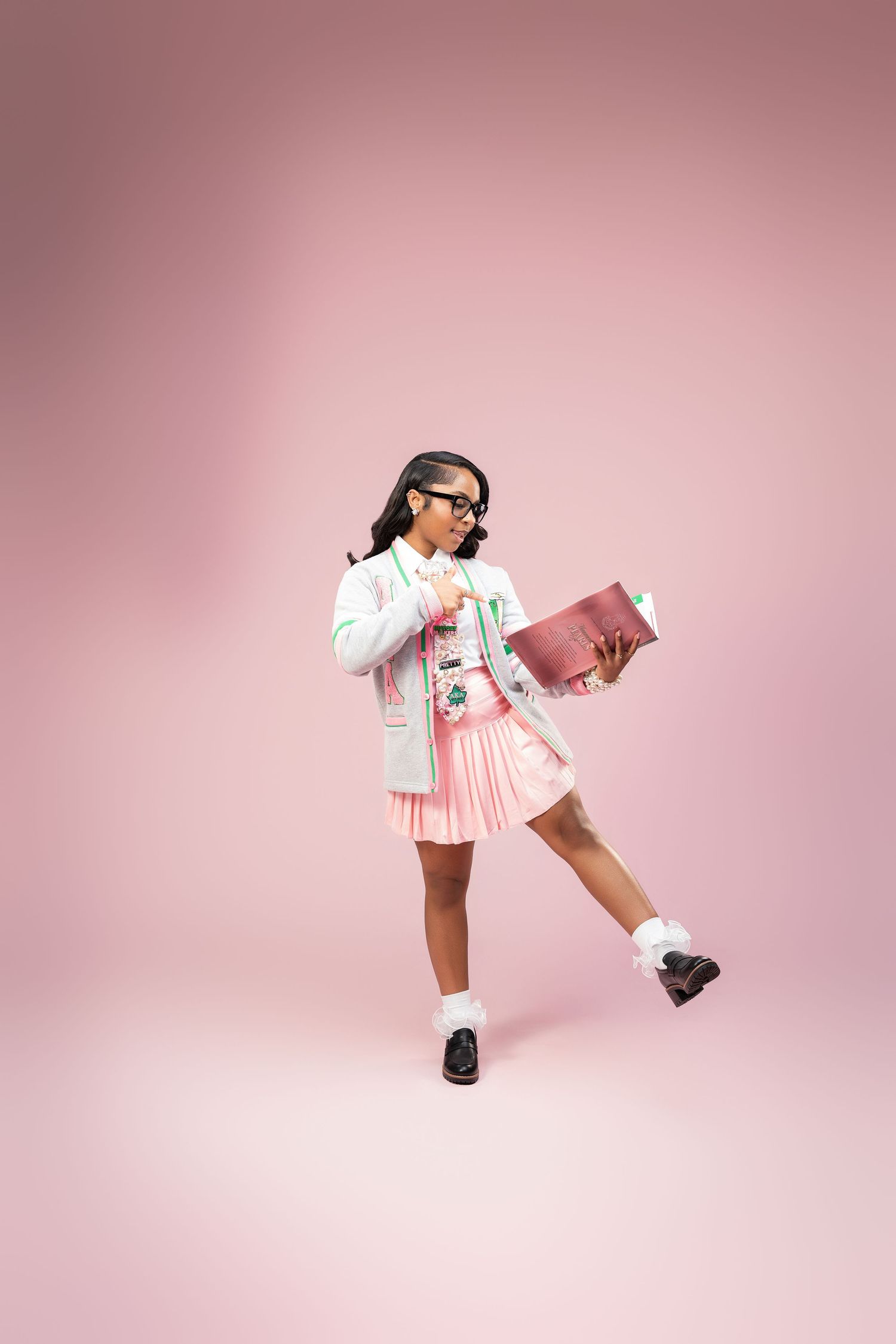 A series of dynamic dance poses against a pink backdrop showing movement and grace in black shoes and pink clothing.