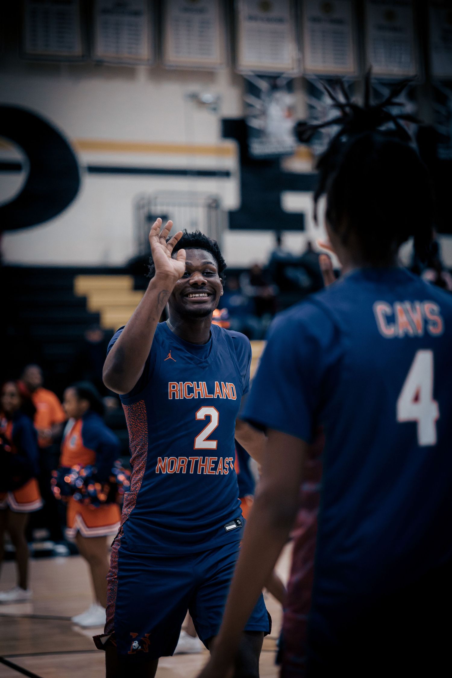 Basketball player celebrating during game in blue jersey number 2.