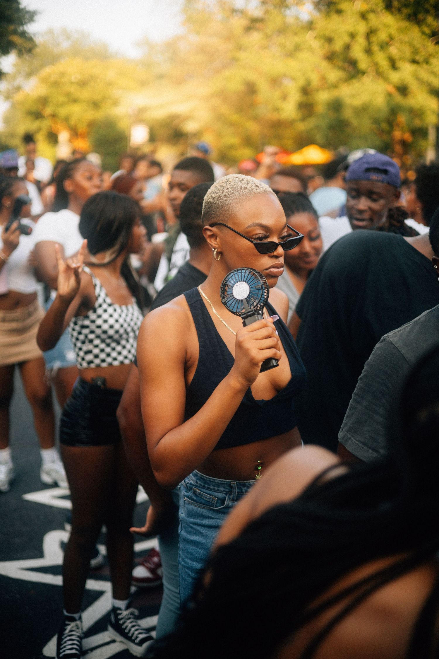 A crowd of people dance together outdoors during what appears to be a daytime social gathering or celebration.  USC Hip Hop Wednesday