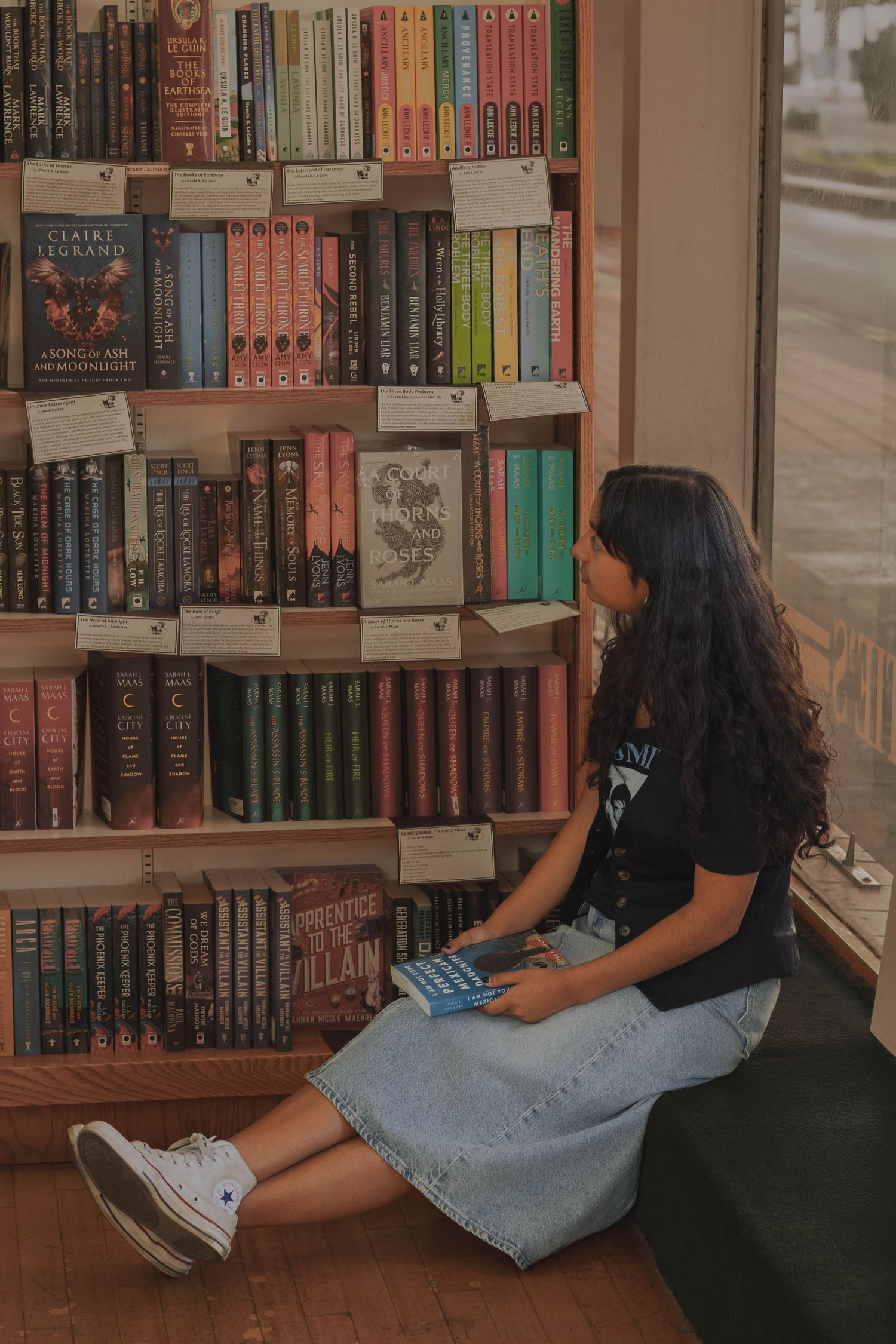 Highschool student posing for senior photos at Auntie's Bookstore in Downtown Spokane, Washington.