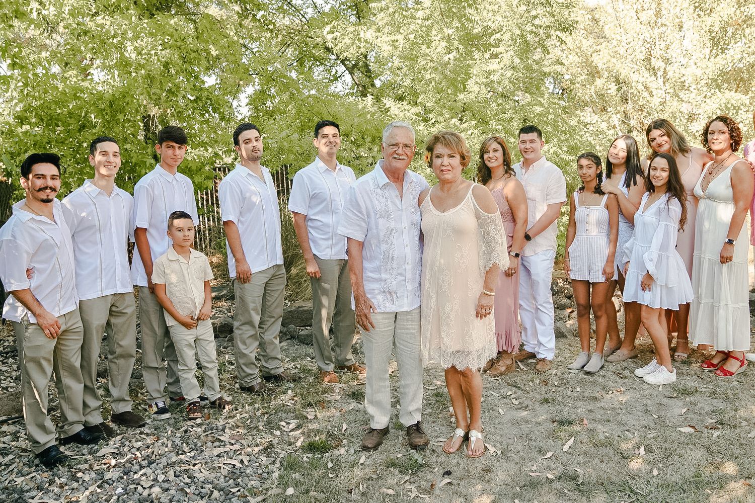 Photo of Bravo family at Grandparent's 50th wedding anniversary celebration, includes aunts, uncles, cousins, siblings.