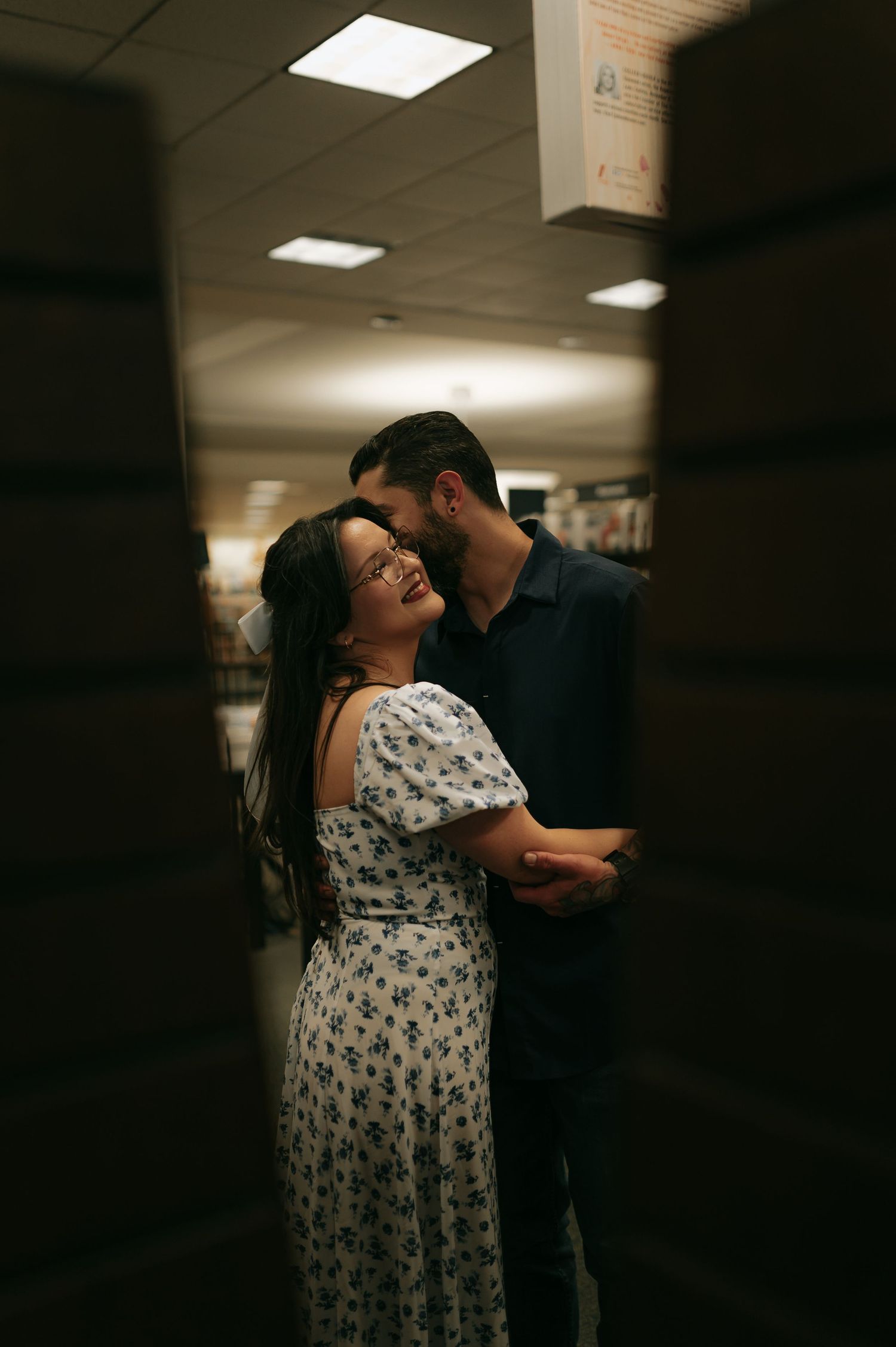 Couple in bookstore in Lubbock, Texas. Bookstore photoshoot in Texas, Library photo ideas