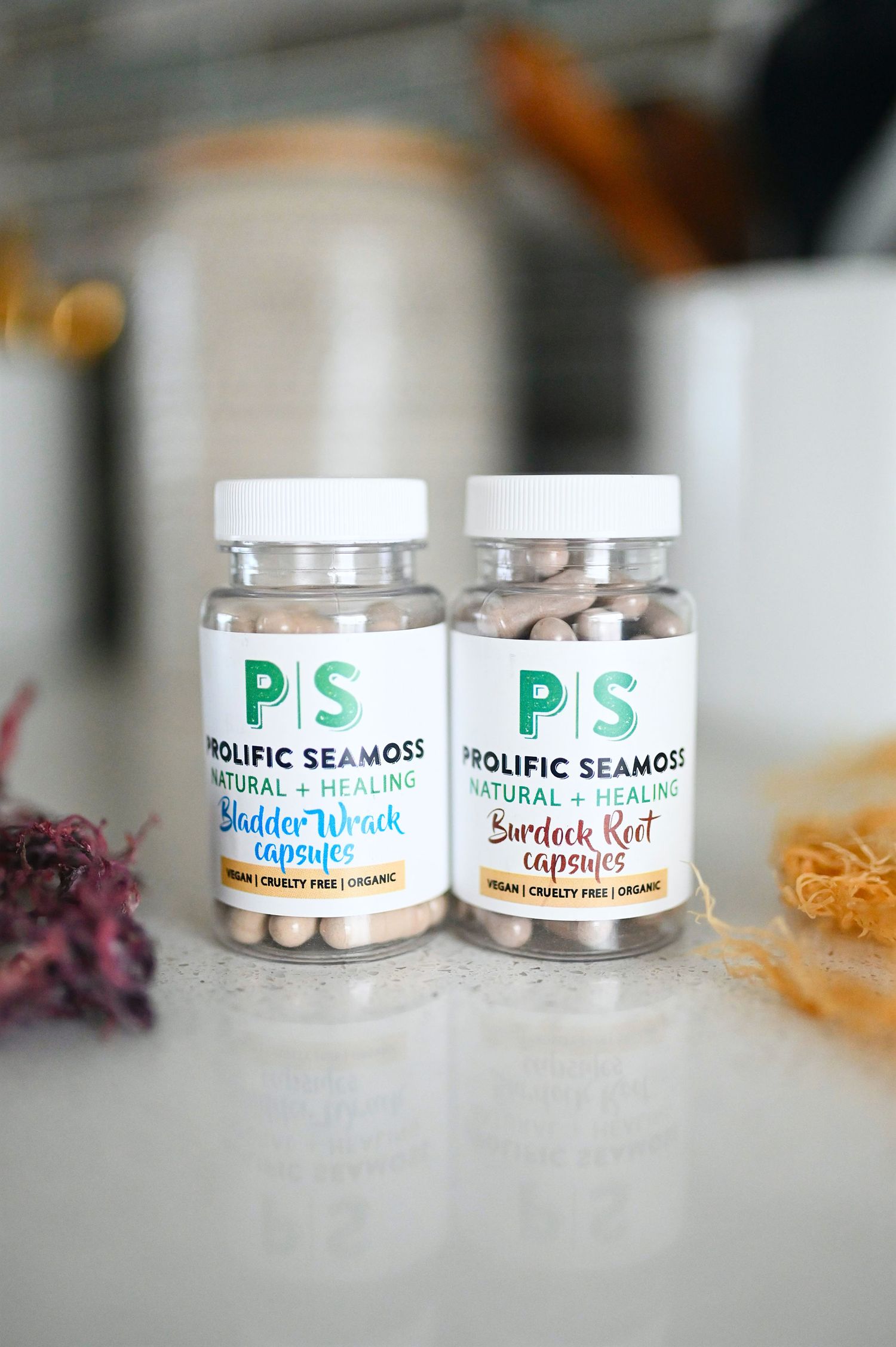 Two bottles of Prolific Seamoss Bladder Wrack and Burdock Root vegan capsules.