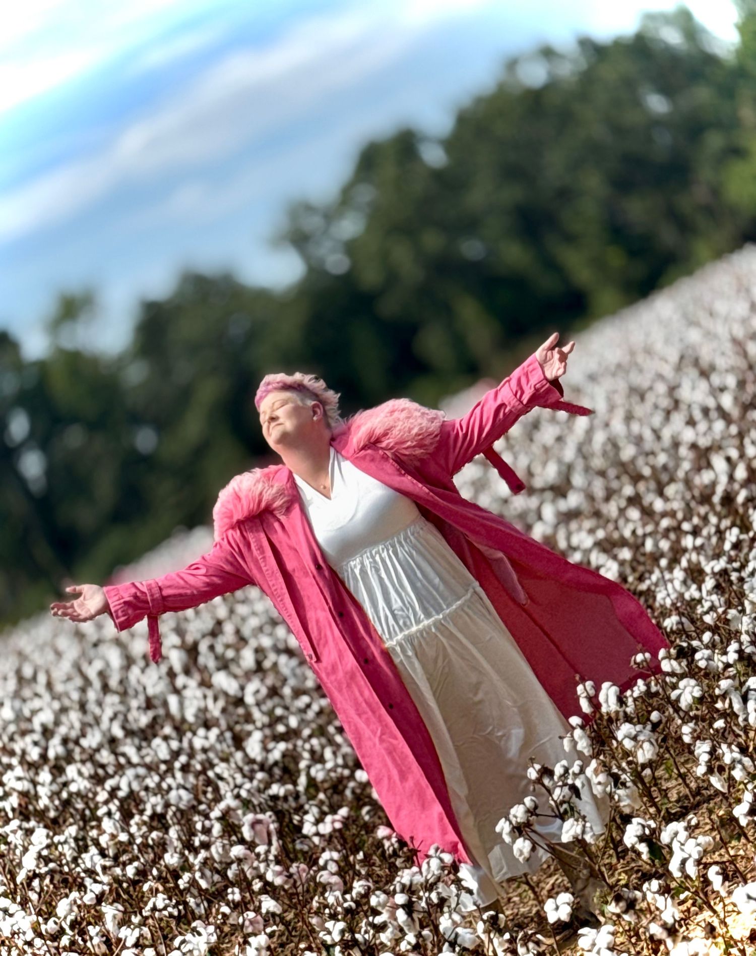 SHE IS FREEBORN!  In this pink jacket twirls joyfully in a blooming cotton field on a sunny day.