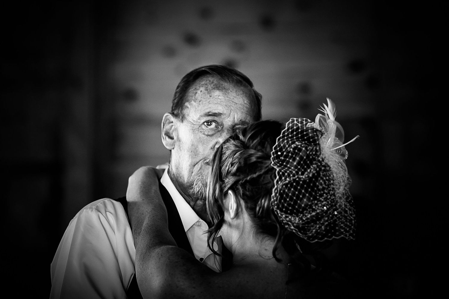 Intimate black and white portrait captures wedding couple's emotional embrace. Taken by Rhode island wedding photographer