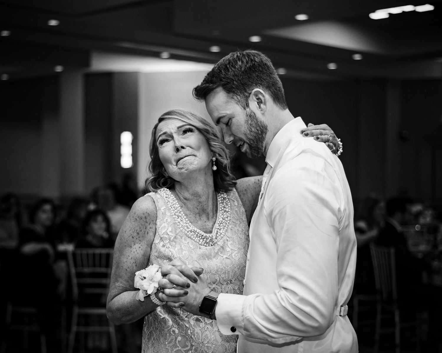 Black and white photo of a couple dancing at their wedding reception. Taken by Rhode island wedding photographer