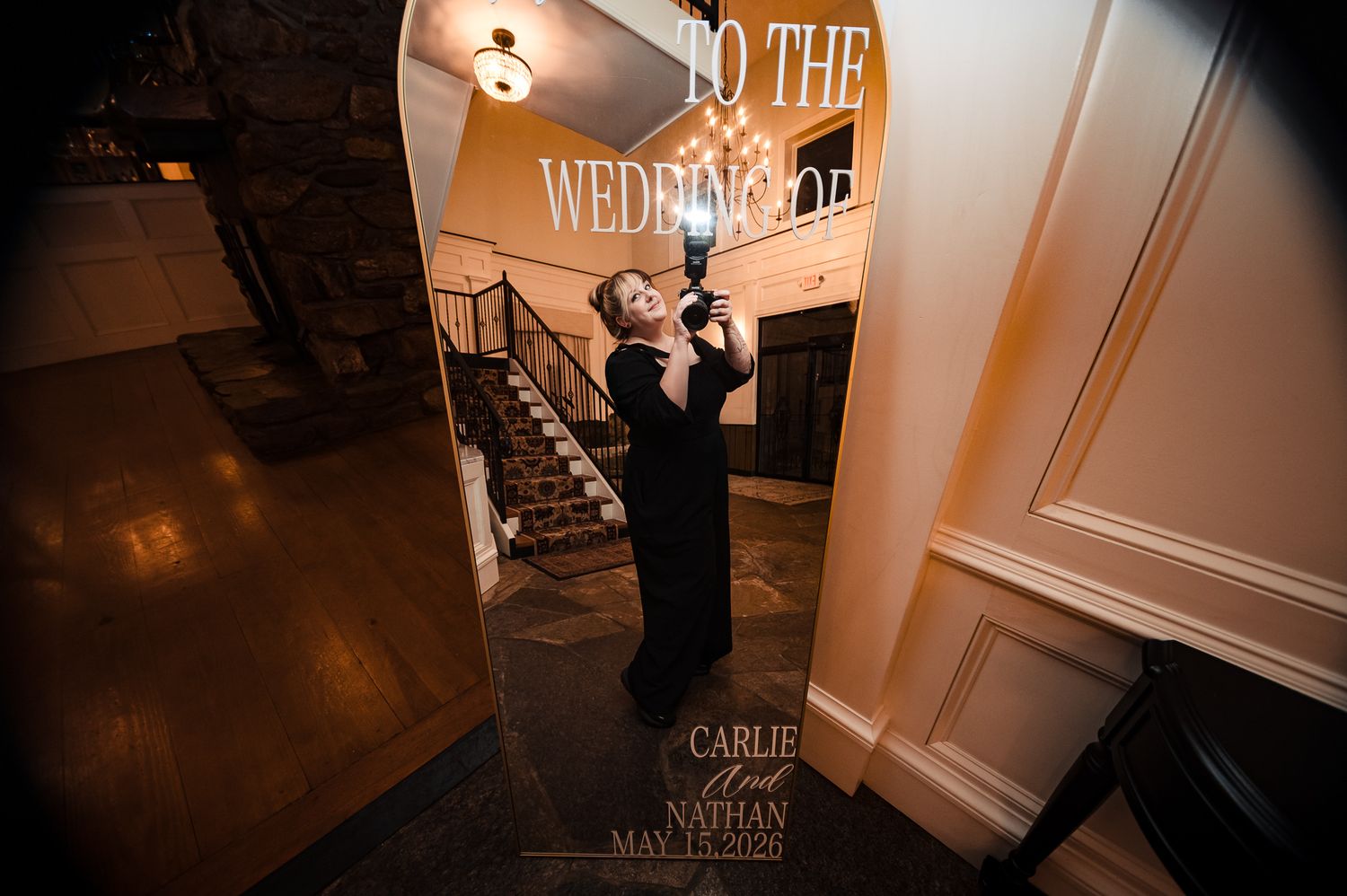 A musician plays violin at the entrance of Carlie and Nathan wedding venue on May 15, 2020.