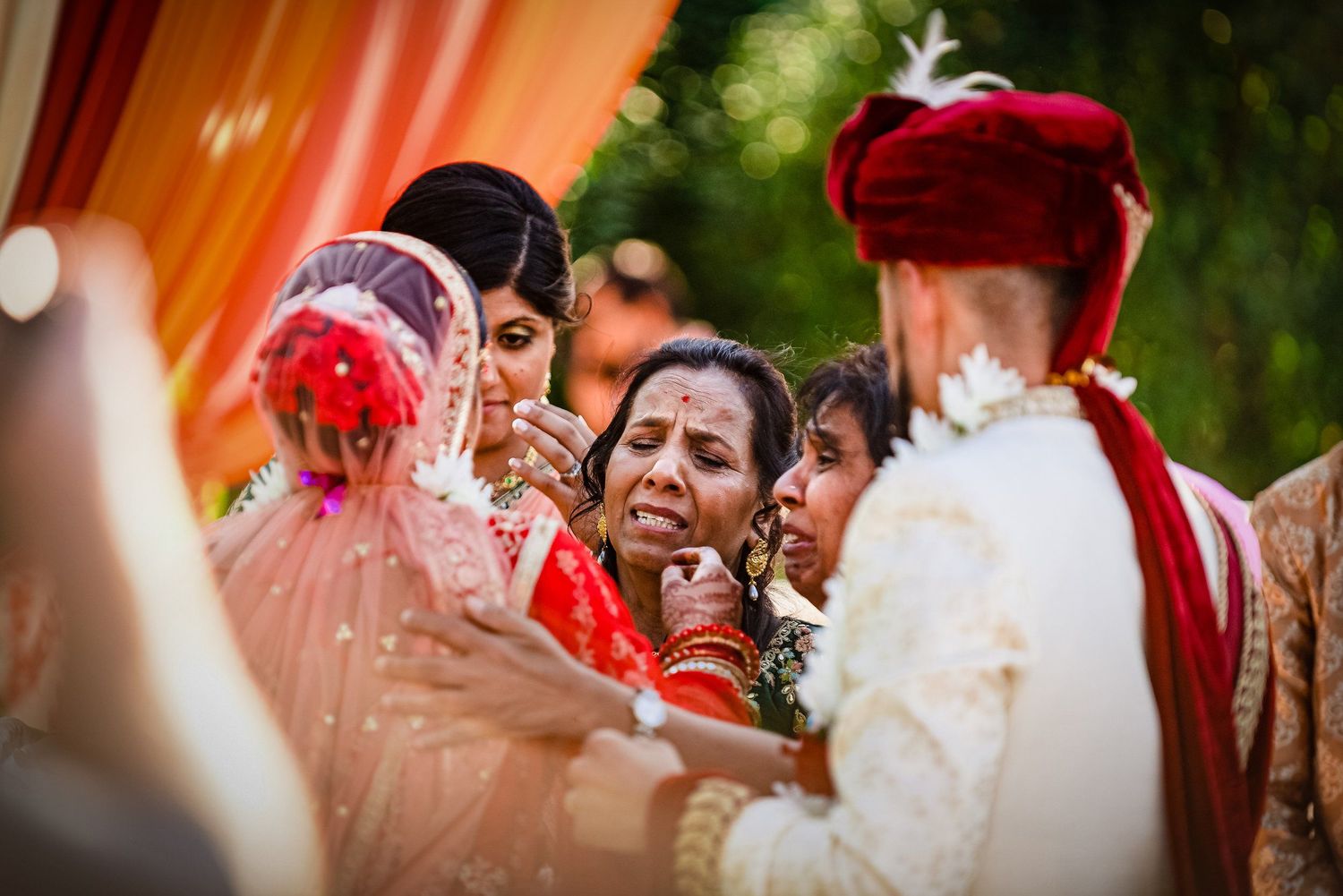 Colorful wedding celebration with traditional Indian attire and decorations. Taken by Rhode island wedding photographer