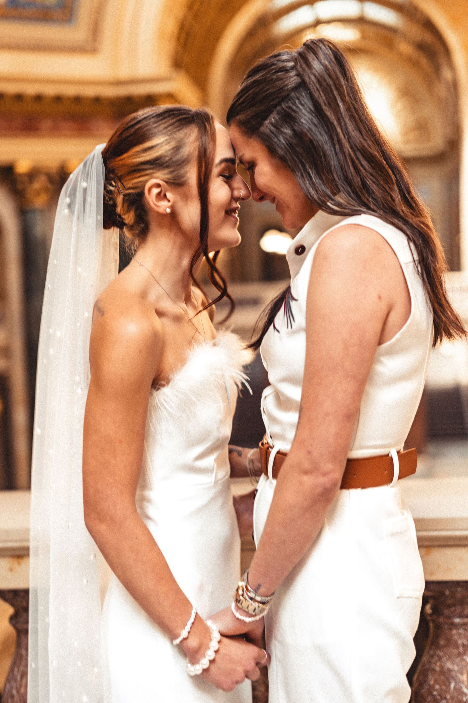 A series of intimate wedding photos showing tender moments between a couple in white attire at an elegant venue.