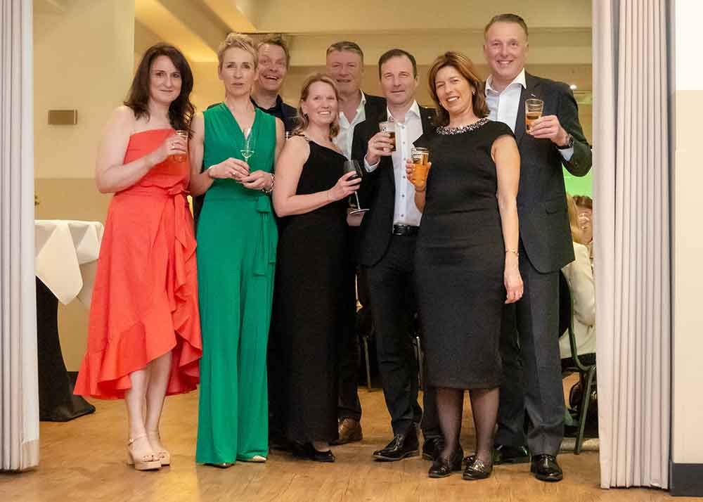 Group portrait photography during a formal event, highlighting connection, elegance, and shared experience.