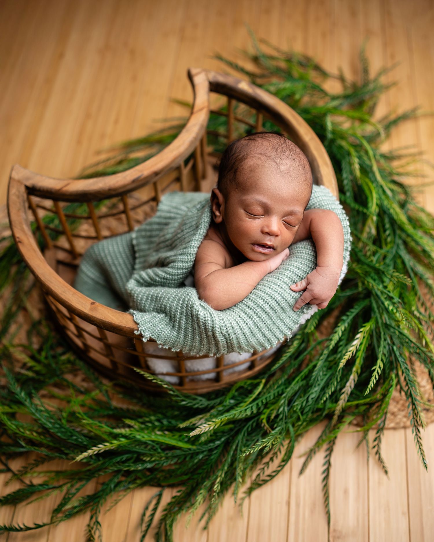 Metro Detroit newborn photographer capturing a peaceful newborn portrait in studio