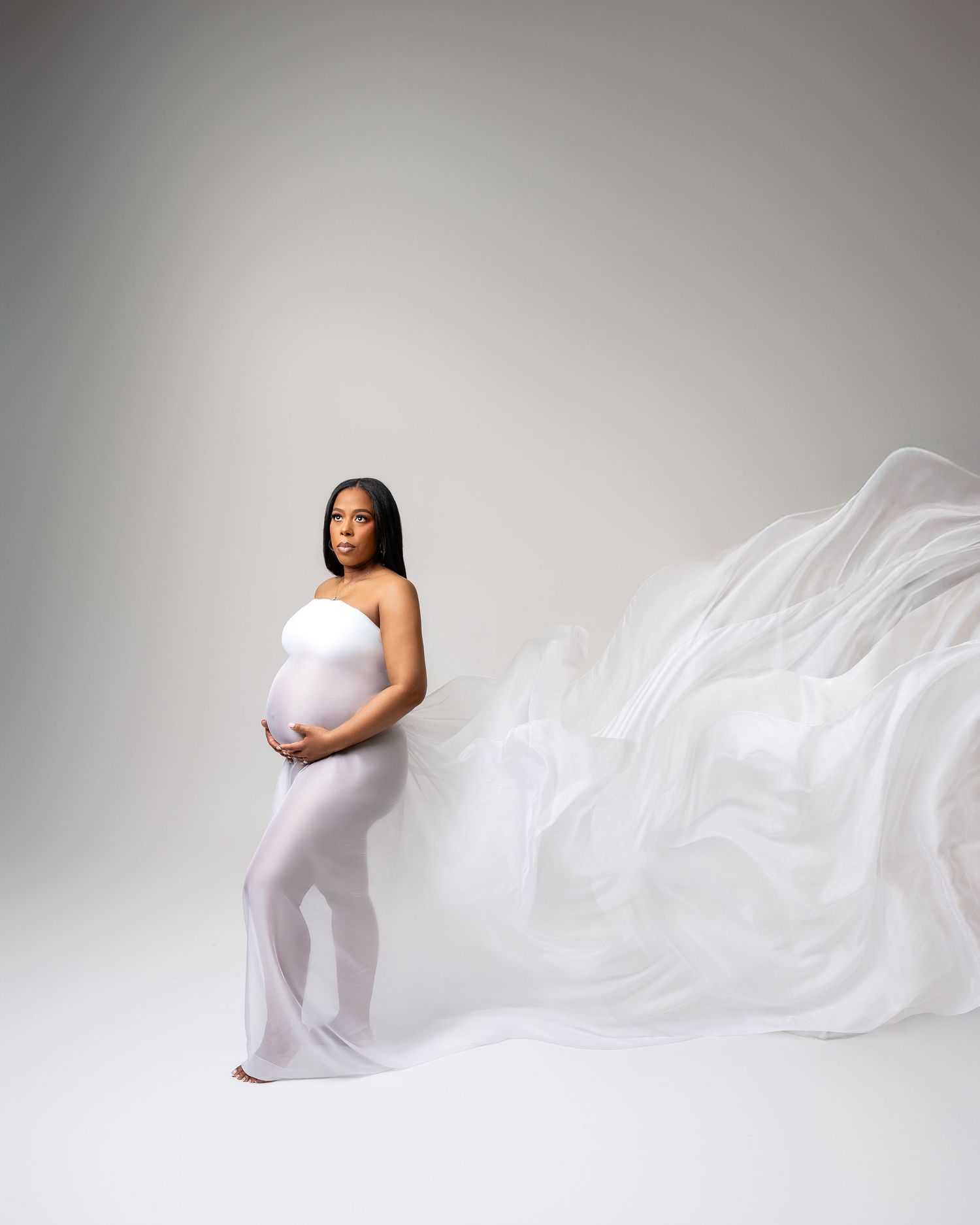 Metro Detroit maternity photographer capturing an expecting mother in studio