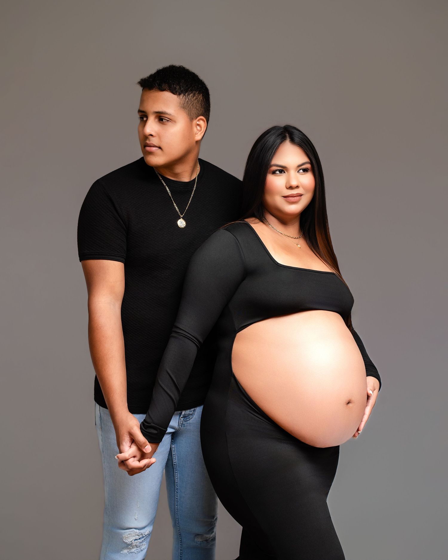 Metro Detroit maternity photographer capturing an expecting couple in studio
