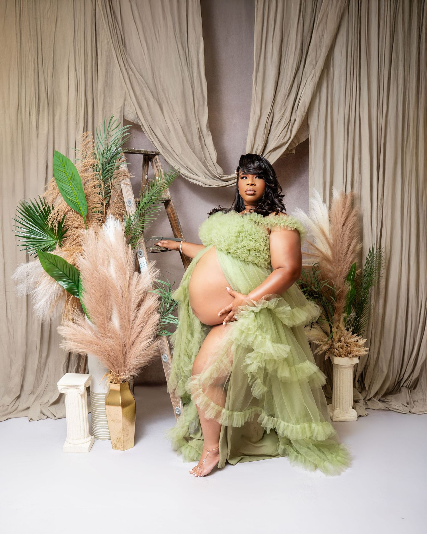 Metro Detroit maternity photographer capturing an expecting mother in studio