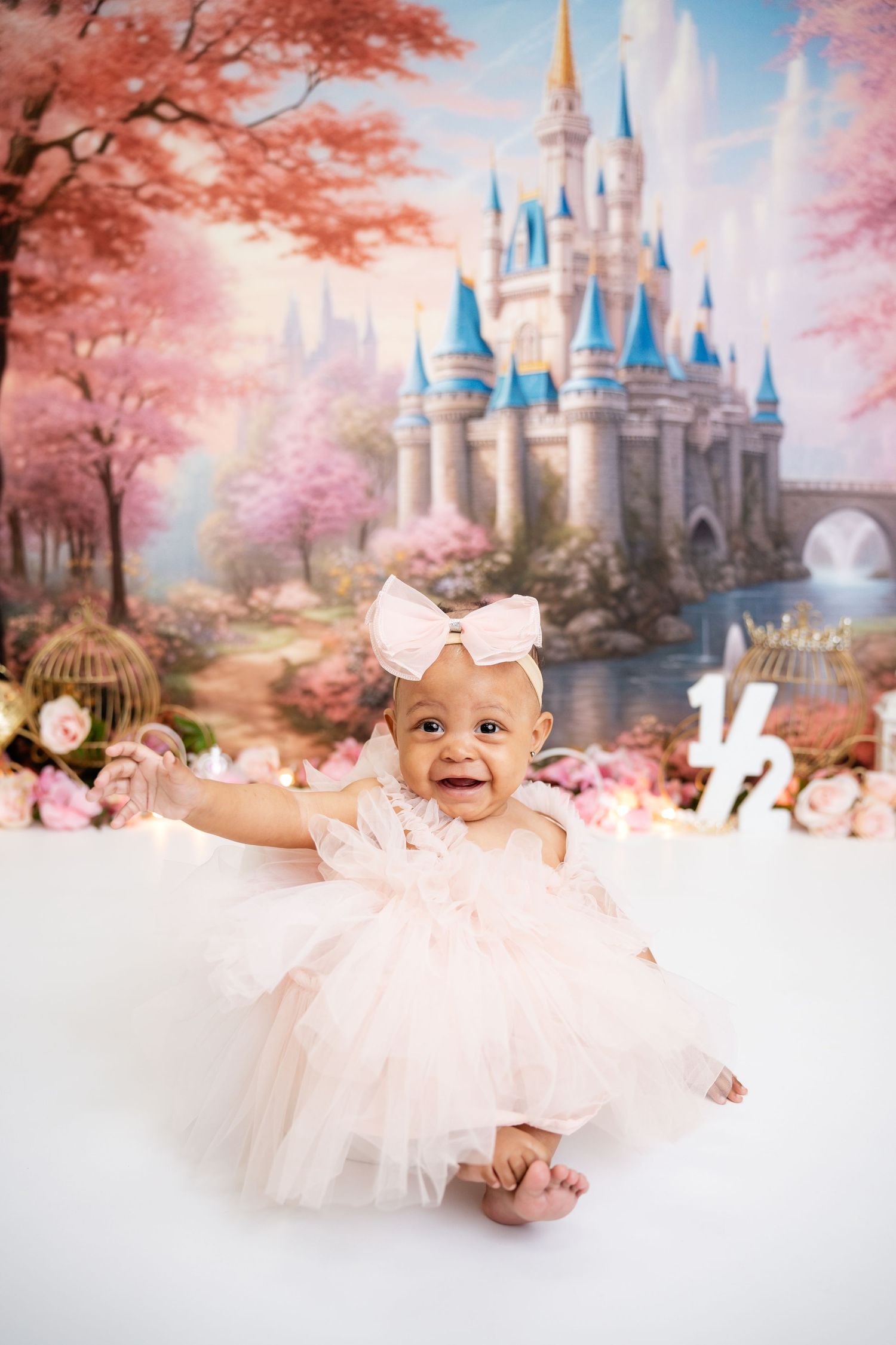 Metro Detroit children photographer Fairytale castle photo setup with pink tulle dress and magical fantasy backdrop.