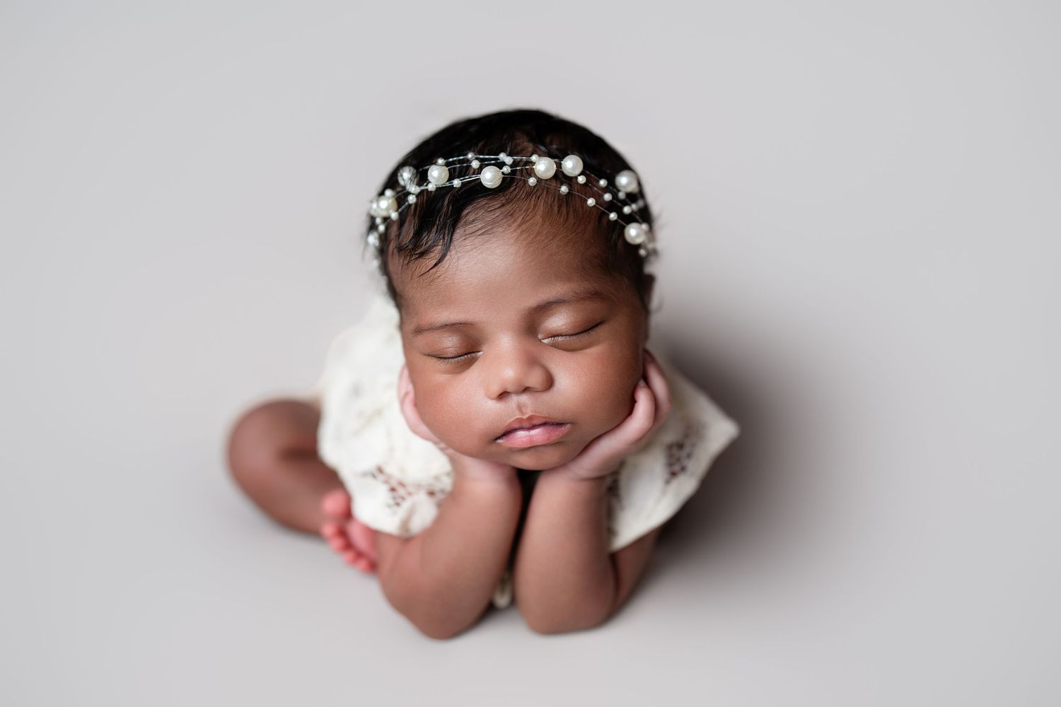 Metro Detroit newborn photographer capturing a peaceful newborn portrait in studio