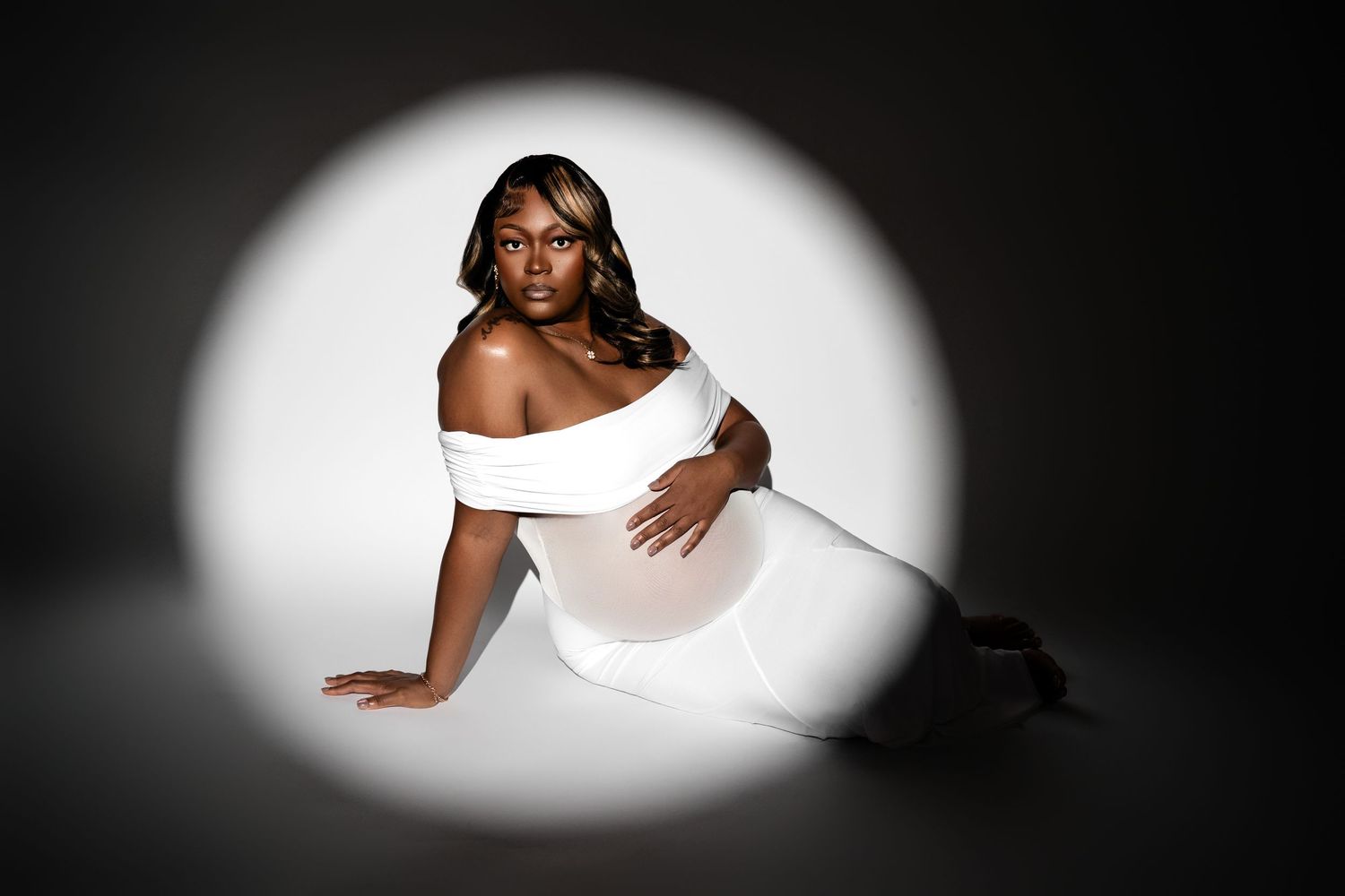 Metro Detroit maternity photographer capturing an expecting mother in studio