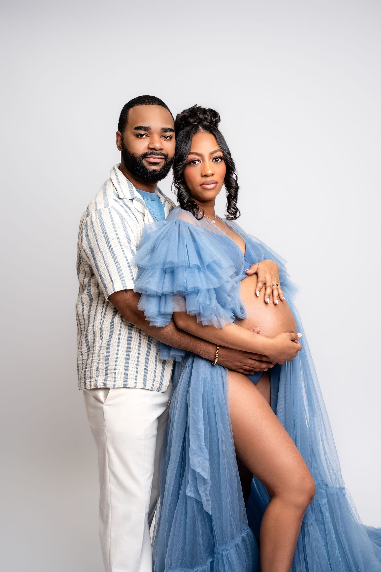 Metro Detroit maternity photographer capturing an expecting mother in studio