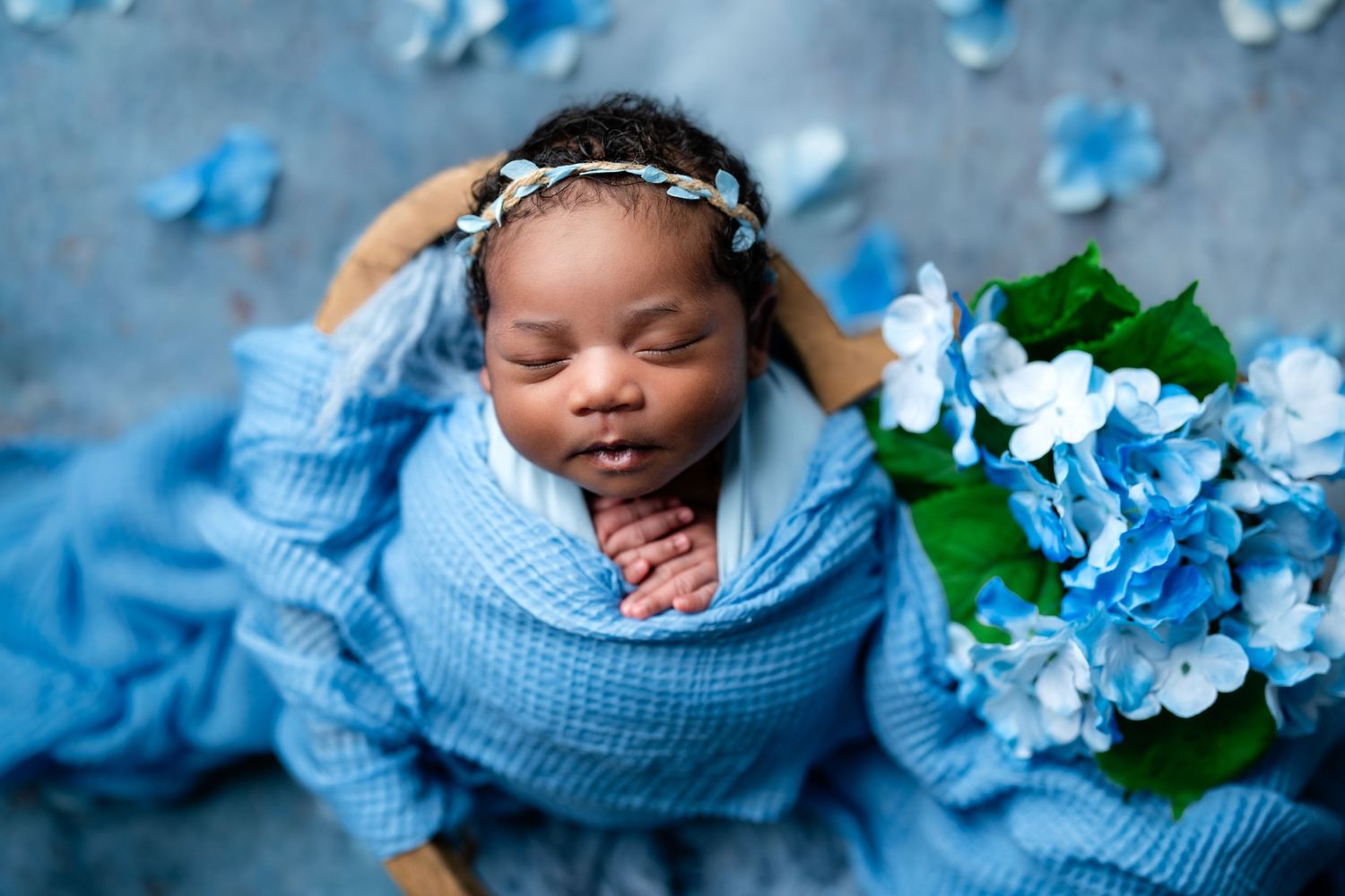 Metro Detroit newborn photographer capturing a peaceful newborn portrait in studio