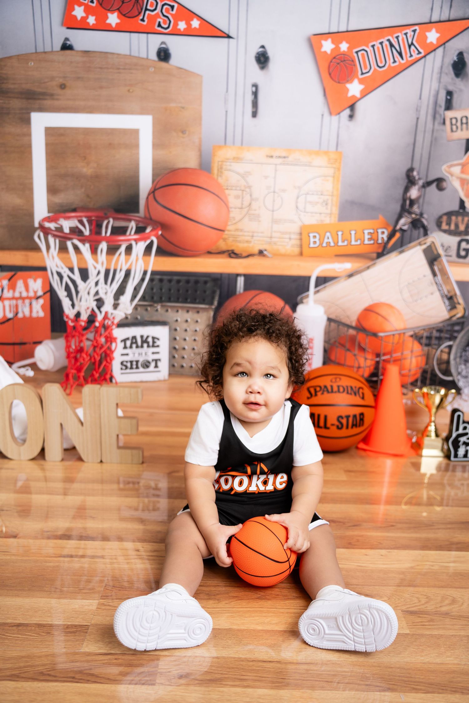 Metro Detroit children photographer photographing a playful toddler in studio Basketball-themed