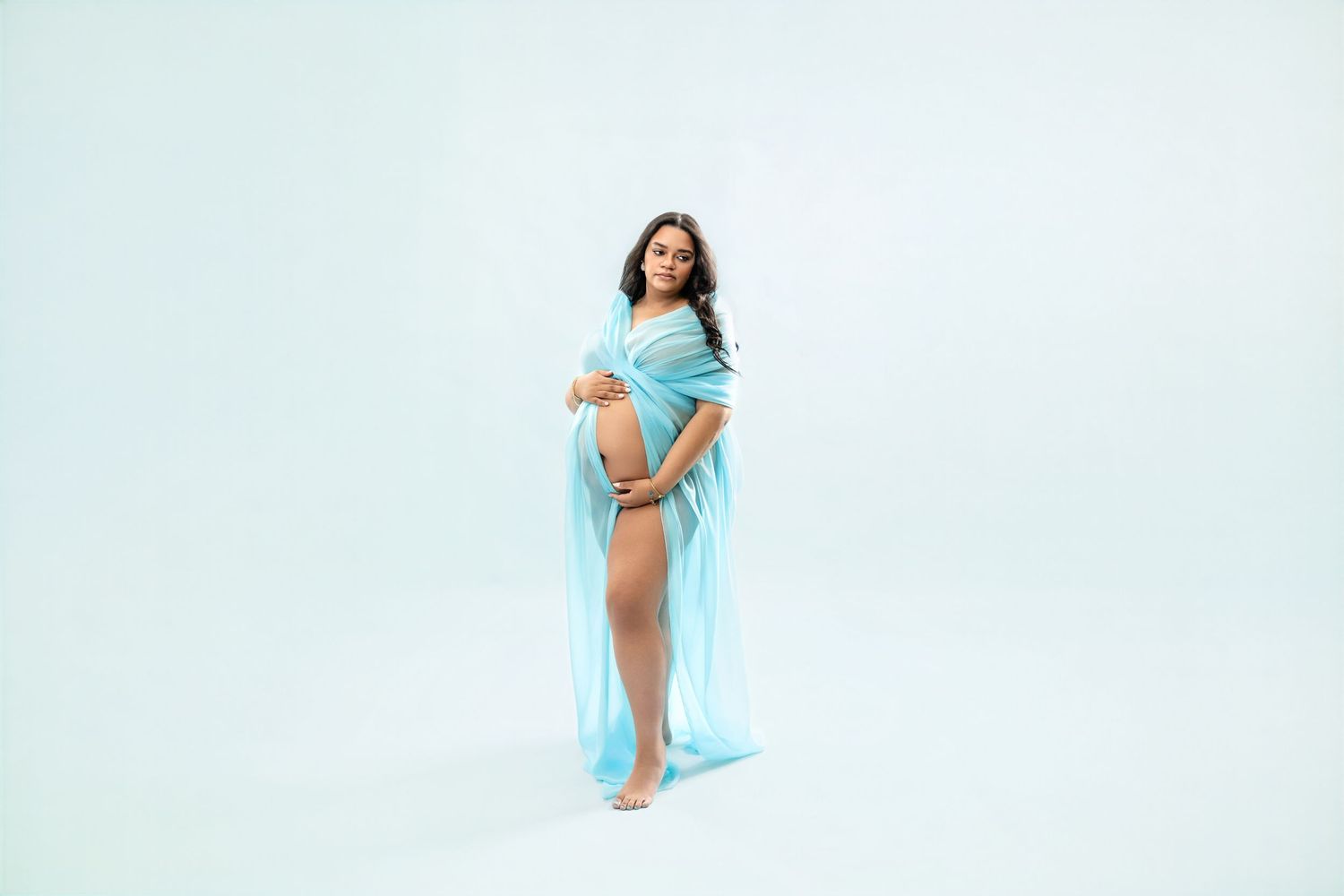 Metro Detroit maternity photographer capturing an expecting mother in studio