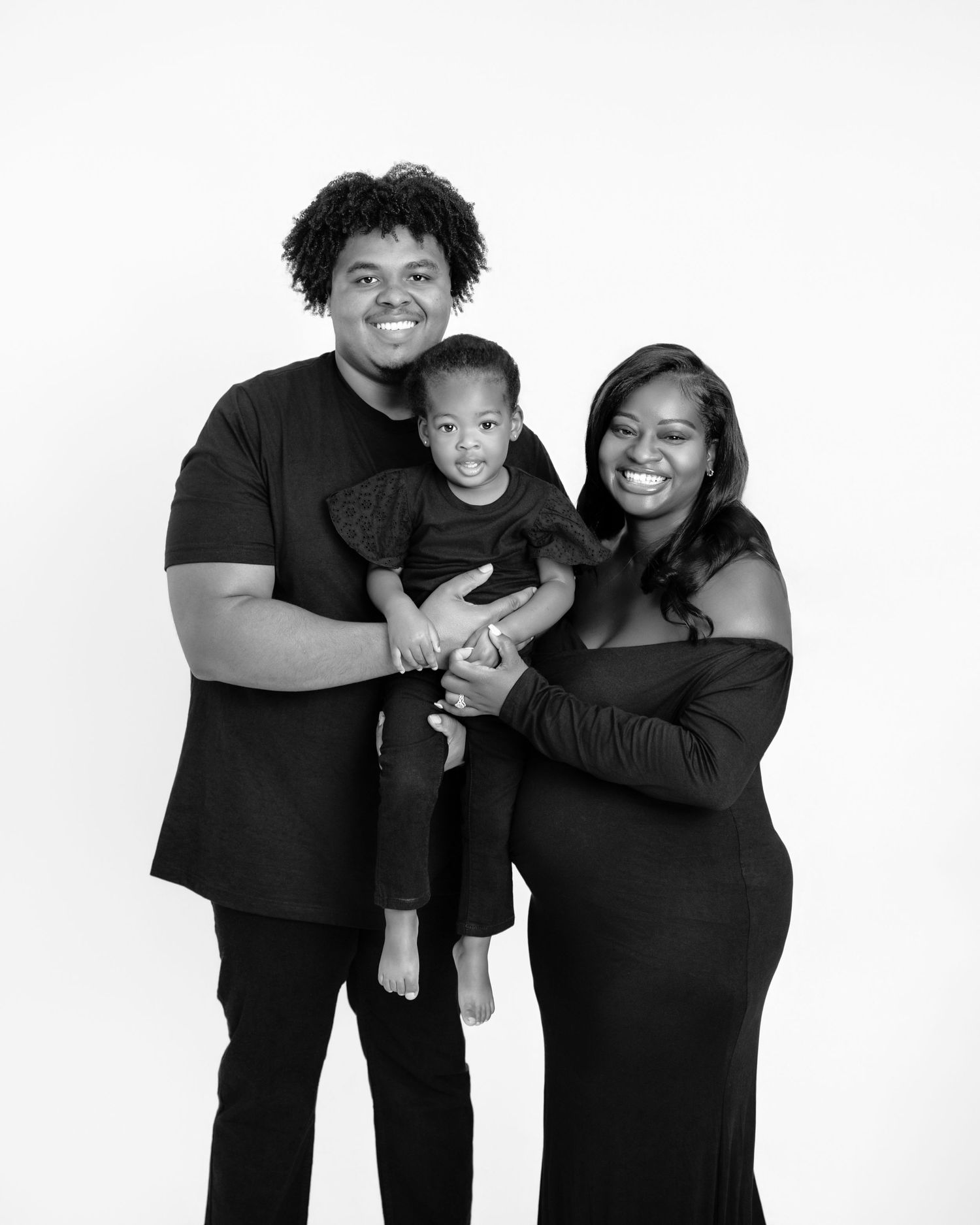 Metro Detroit maternity photographer capturing an expecting mother and family in studio