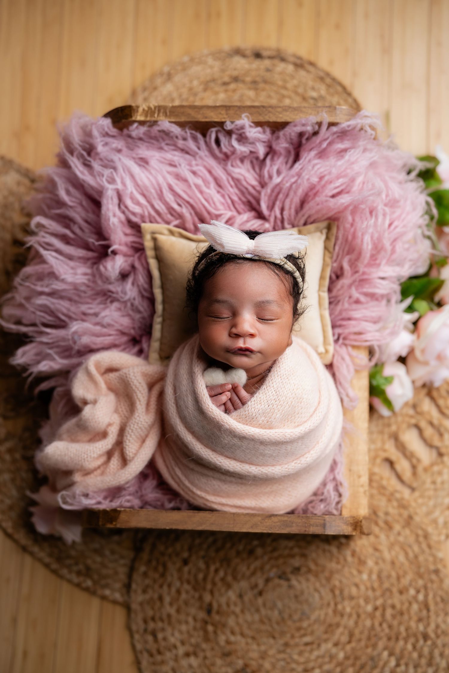 Metro Detroit newborn photographer capturing a peaceful newborn portrait in studio